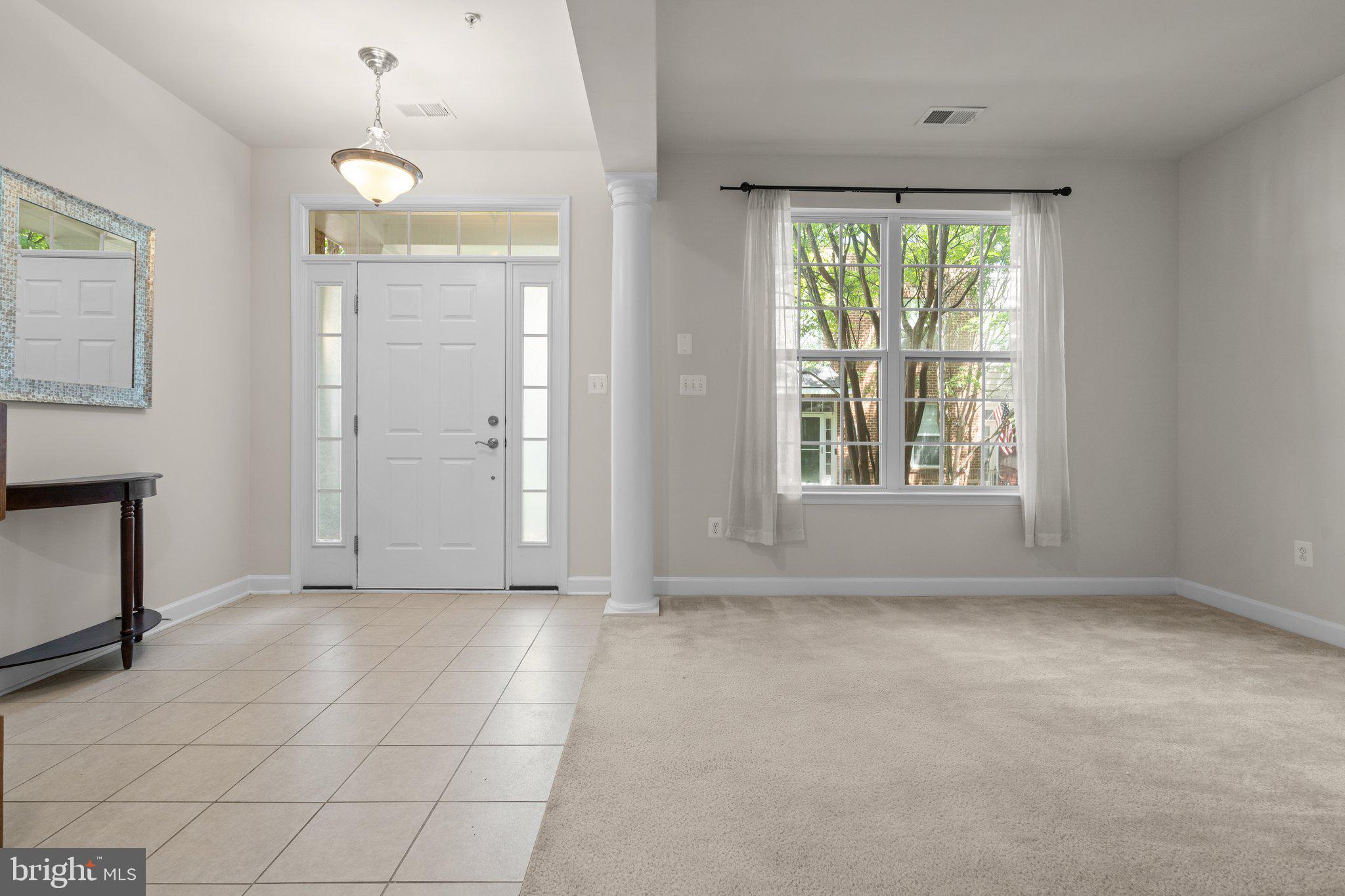 11669 Leesborough Circle Silver Spring, MD 20902 - Photo 38 of 46 an empty room with windows and entrance