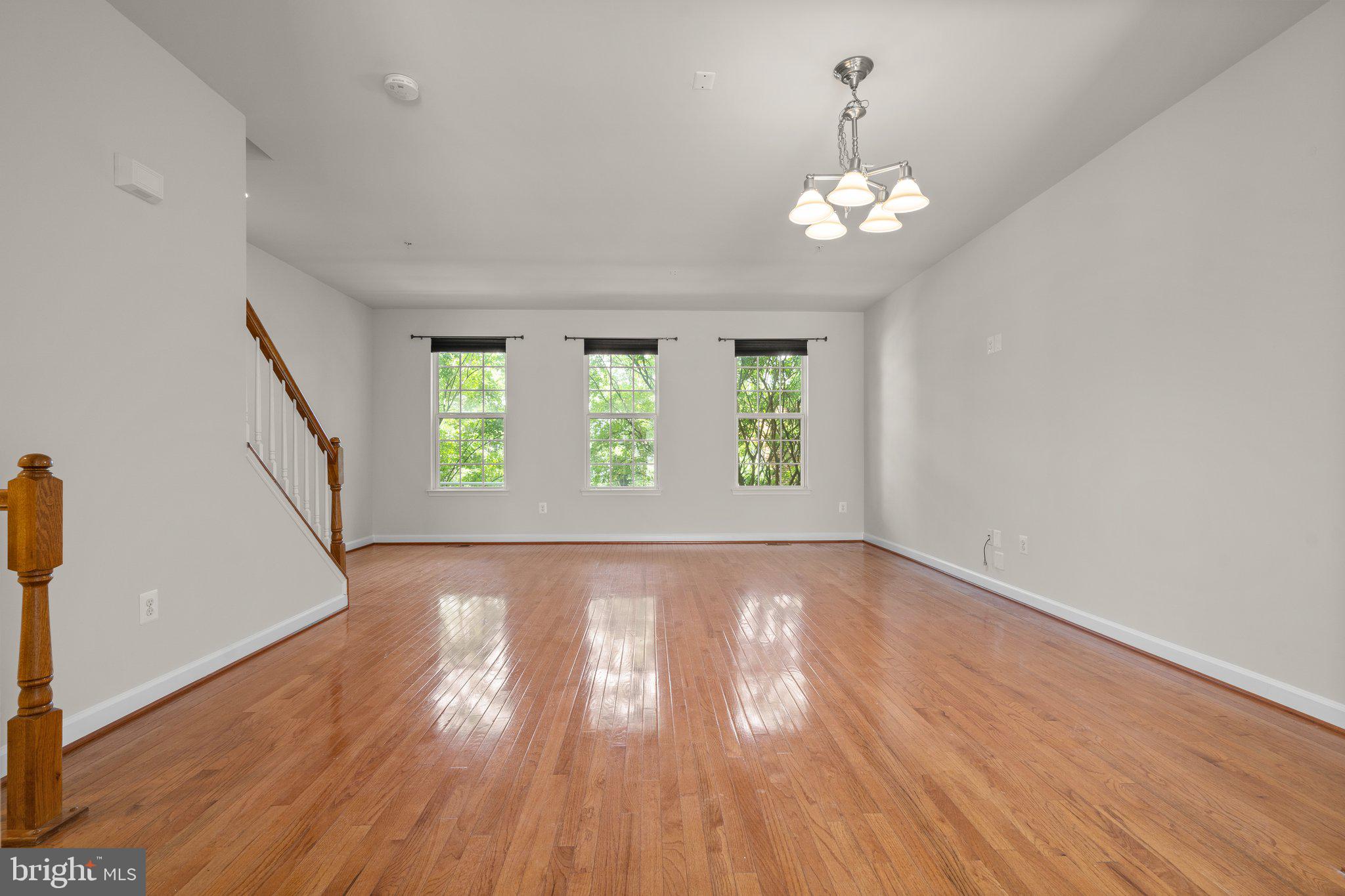 11669 Leesborough Circle Silver Spring, MD 20902 - Photo 4 of 46 wooden floor in an empty room with a window