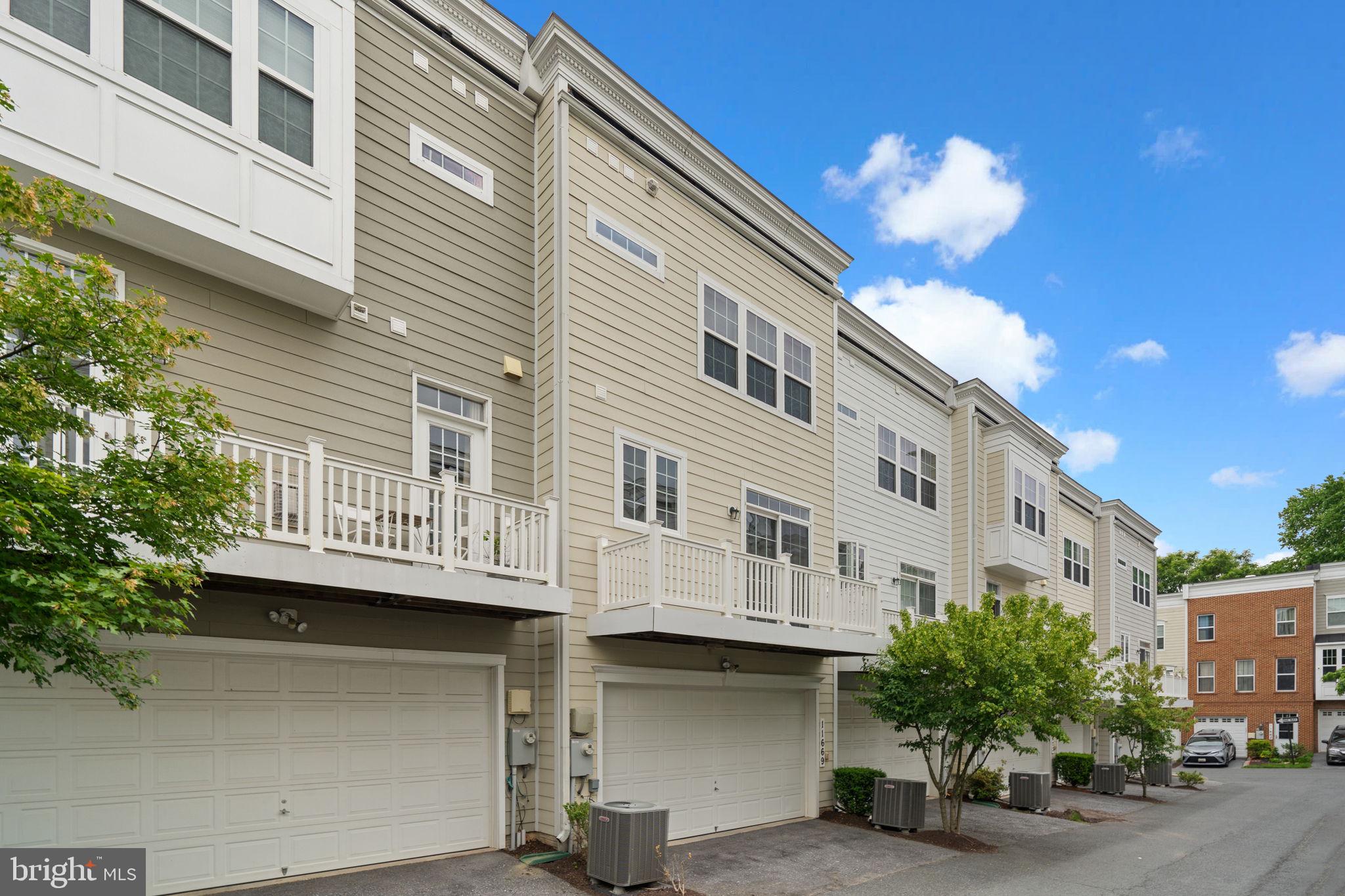 11669 Leesborough Circle Silver Spring, MD 20902 - Photo 44 of 46 a view of a building with a lot of flower plants