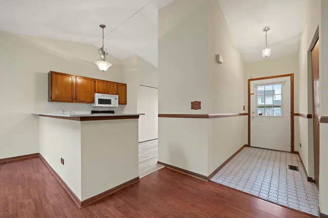 a view of kitchen space with wooden floor