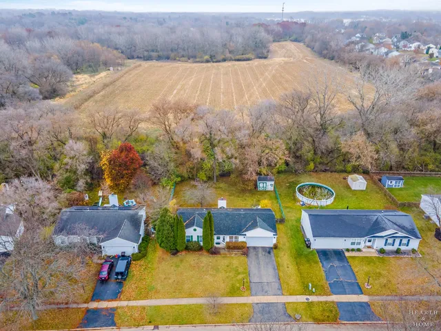 an aerial view of a house with a swimming pool