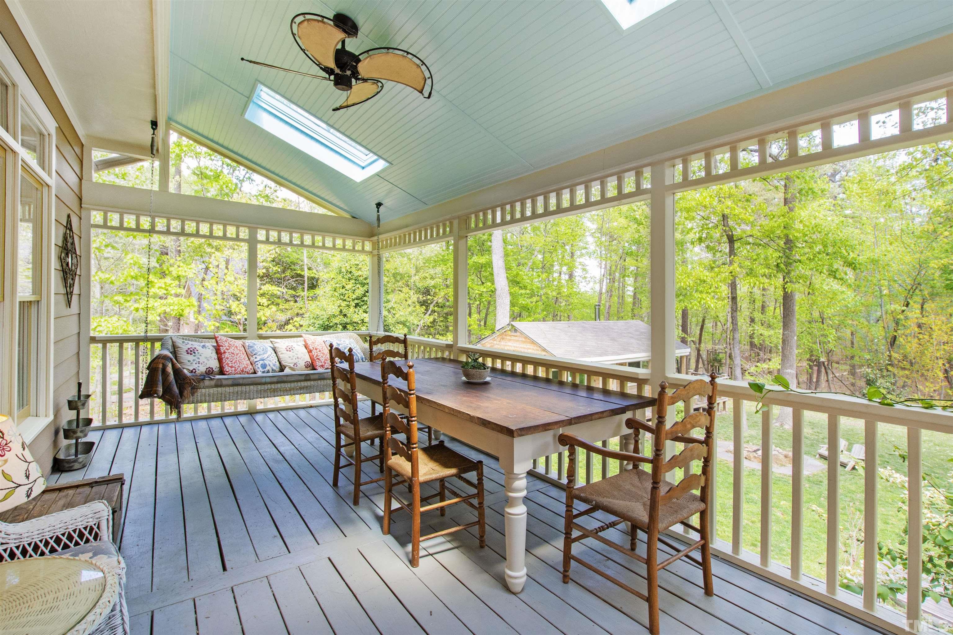 7039 Calais Drive Durham, NC 27712 - Photo 14 of 33 a dining room with furniture window wooden floor