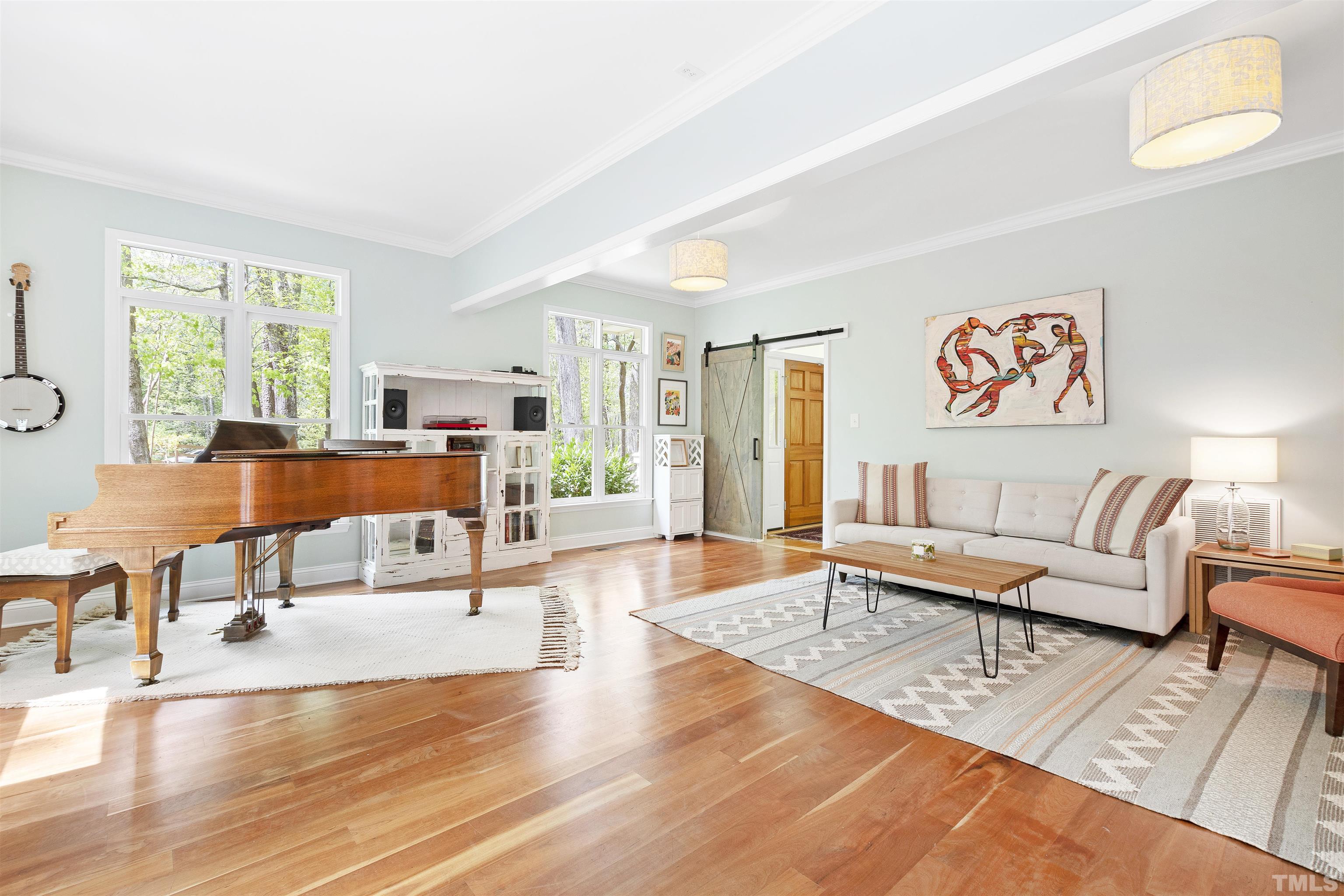 7039 Calais Drive Durham, NC 27712 - Photo 16 of 33 a living room with furniture and wooden floor