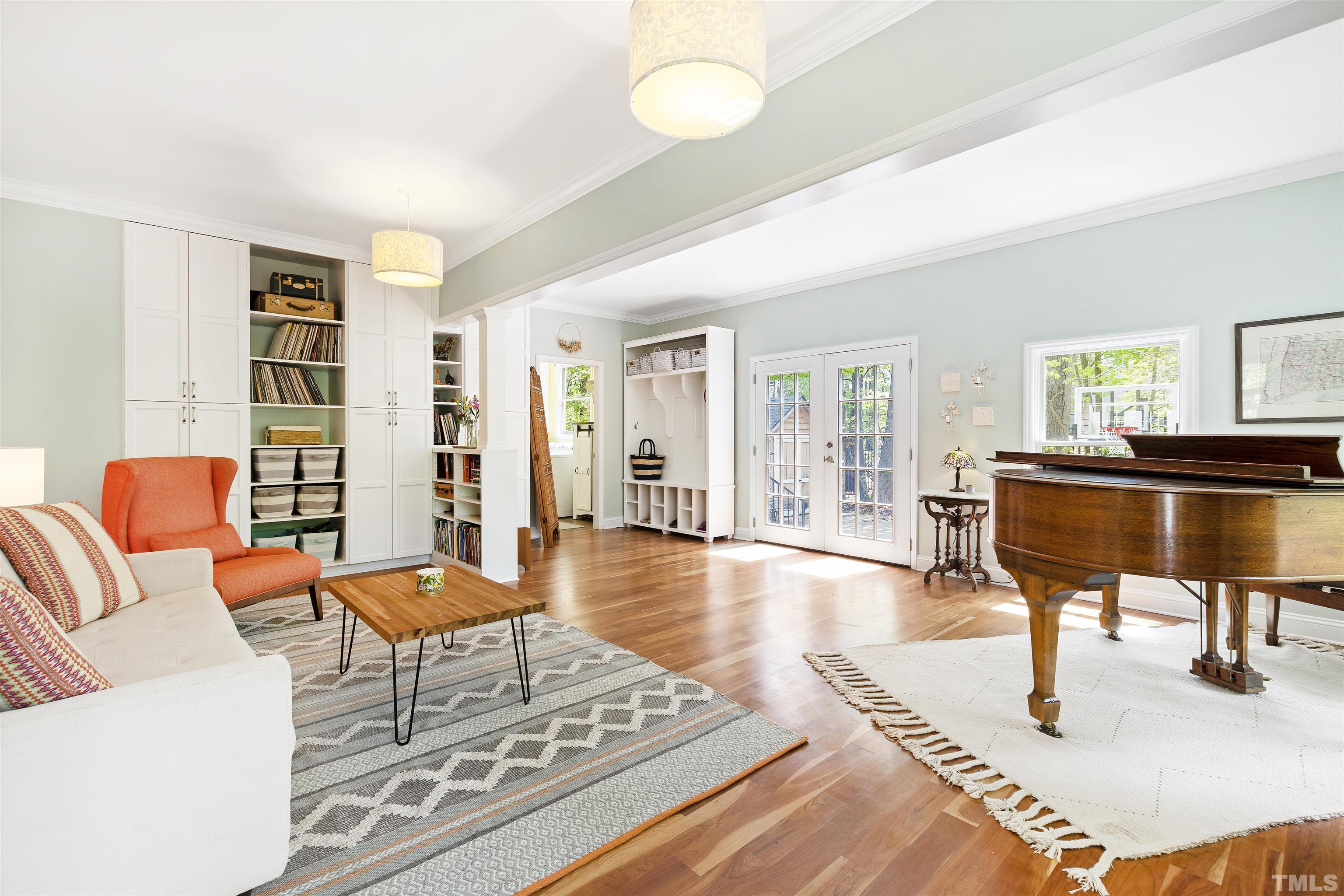 7039 Calais Drive Durham, NC 27712 - Photo 17 of 33 a living room with furniture and a wooden floor