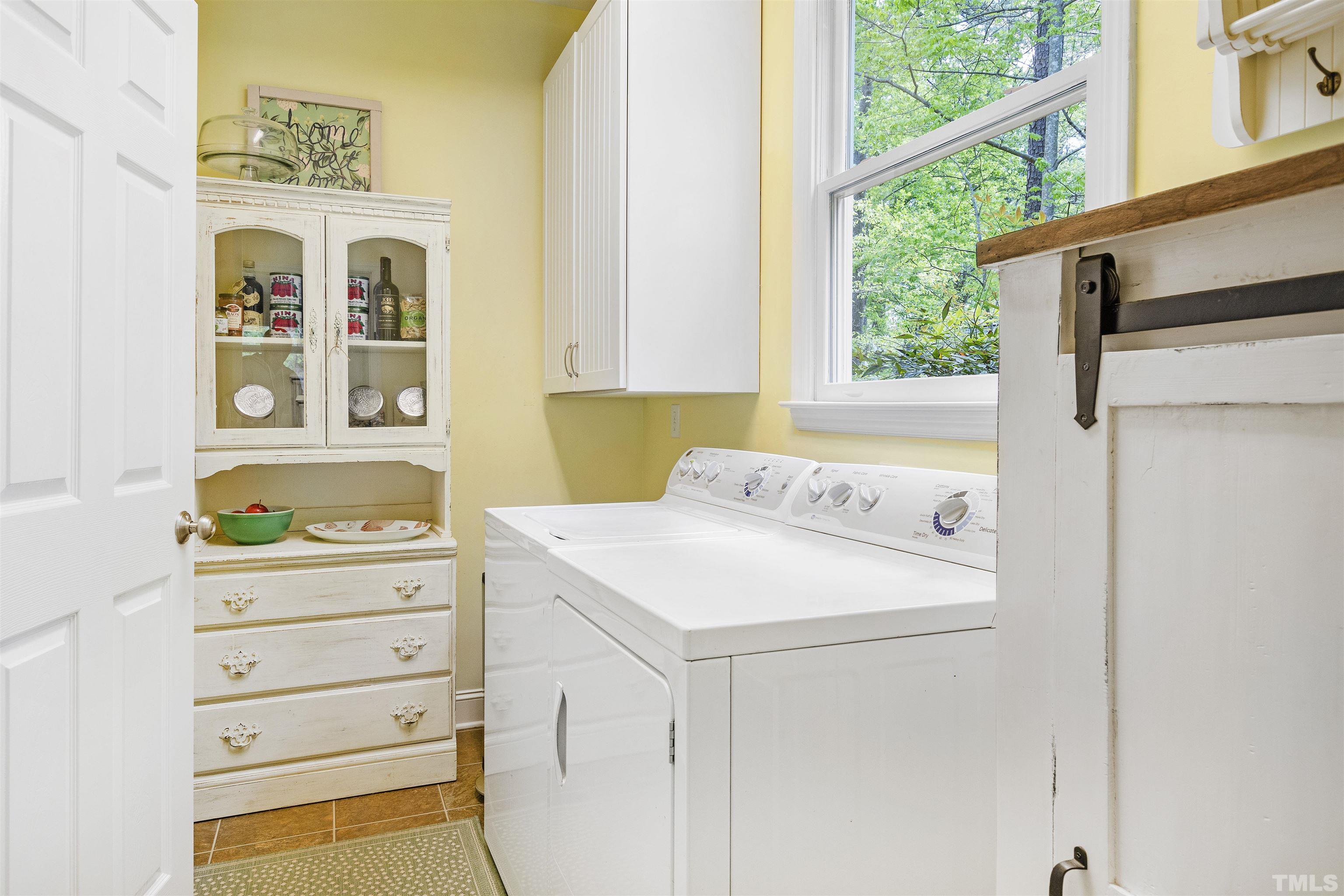 7039 Calais Drive Durham, NC 27712 - Photo 18 of 33 a utility room with dryer and washer