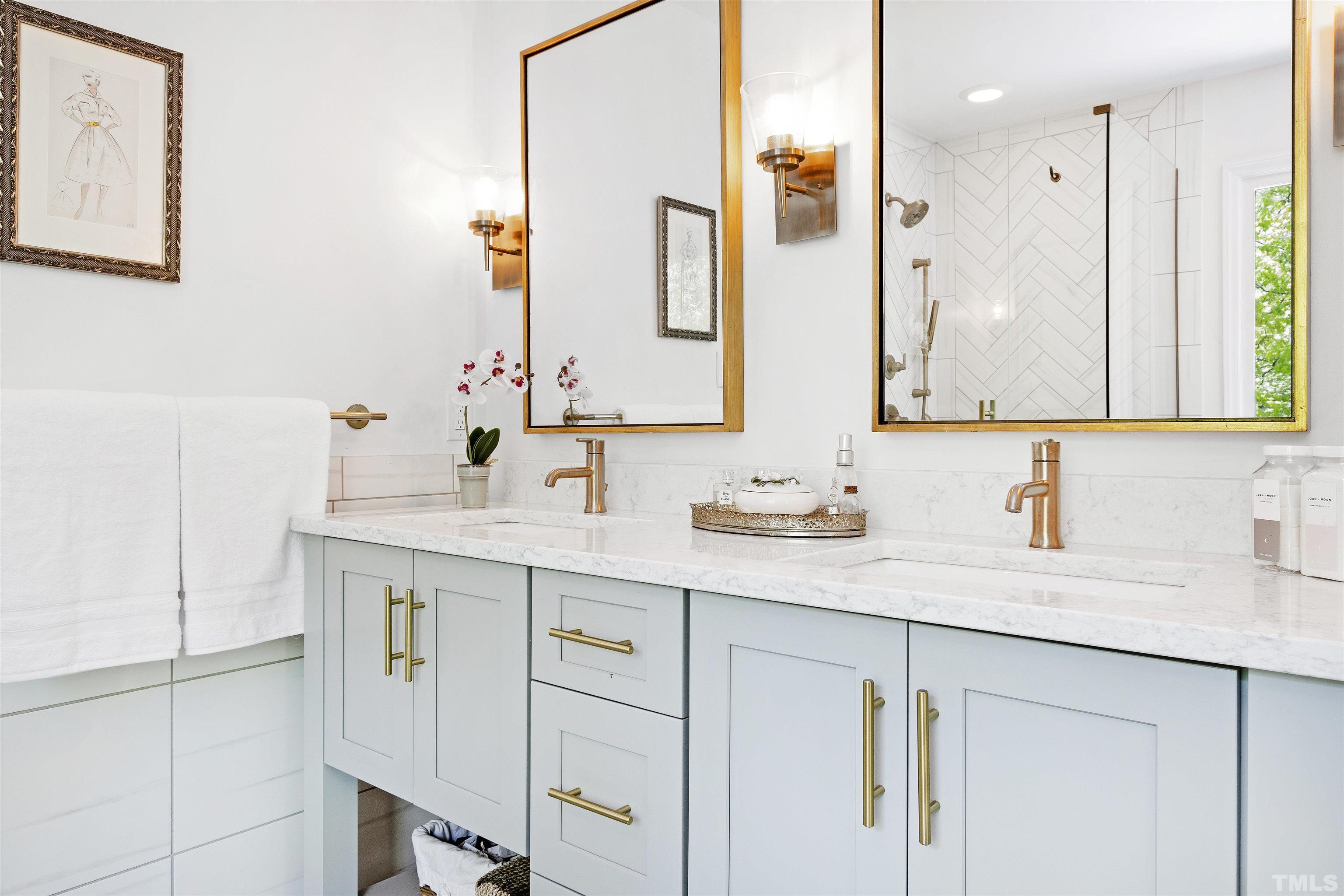7039 Calais Drive Durham, NC 27712 - Photo 21 of 33 a bathroom with a sink and a mirror