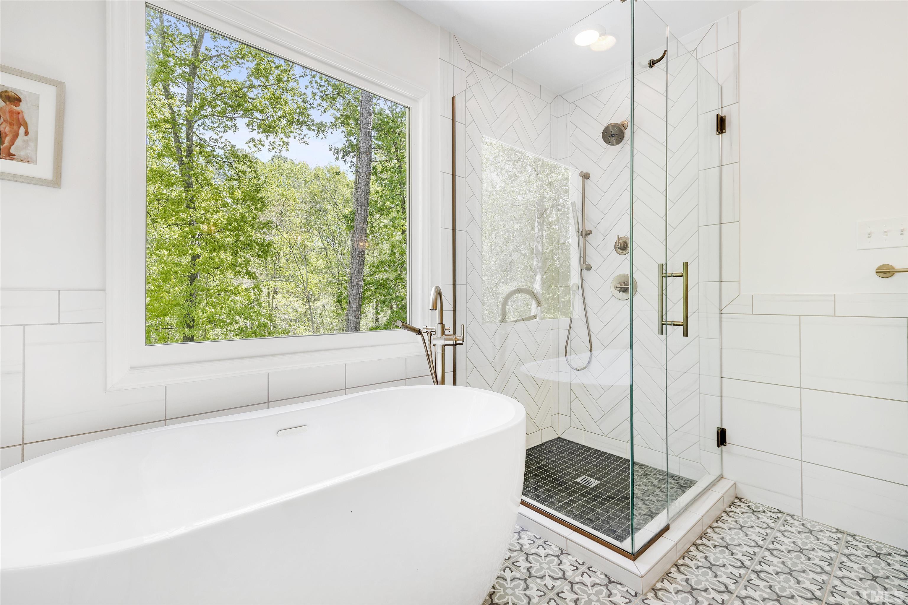 7039 Calais Drive Durham, NC 27712 - Photo 22 of 33 a bathroom with a granite countertop tub shower and sink