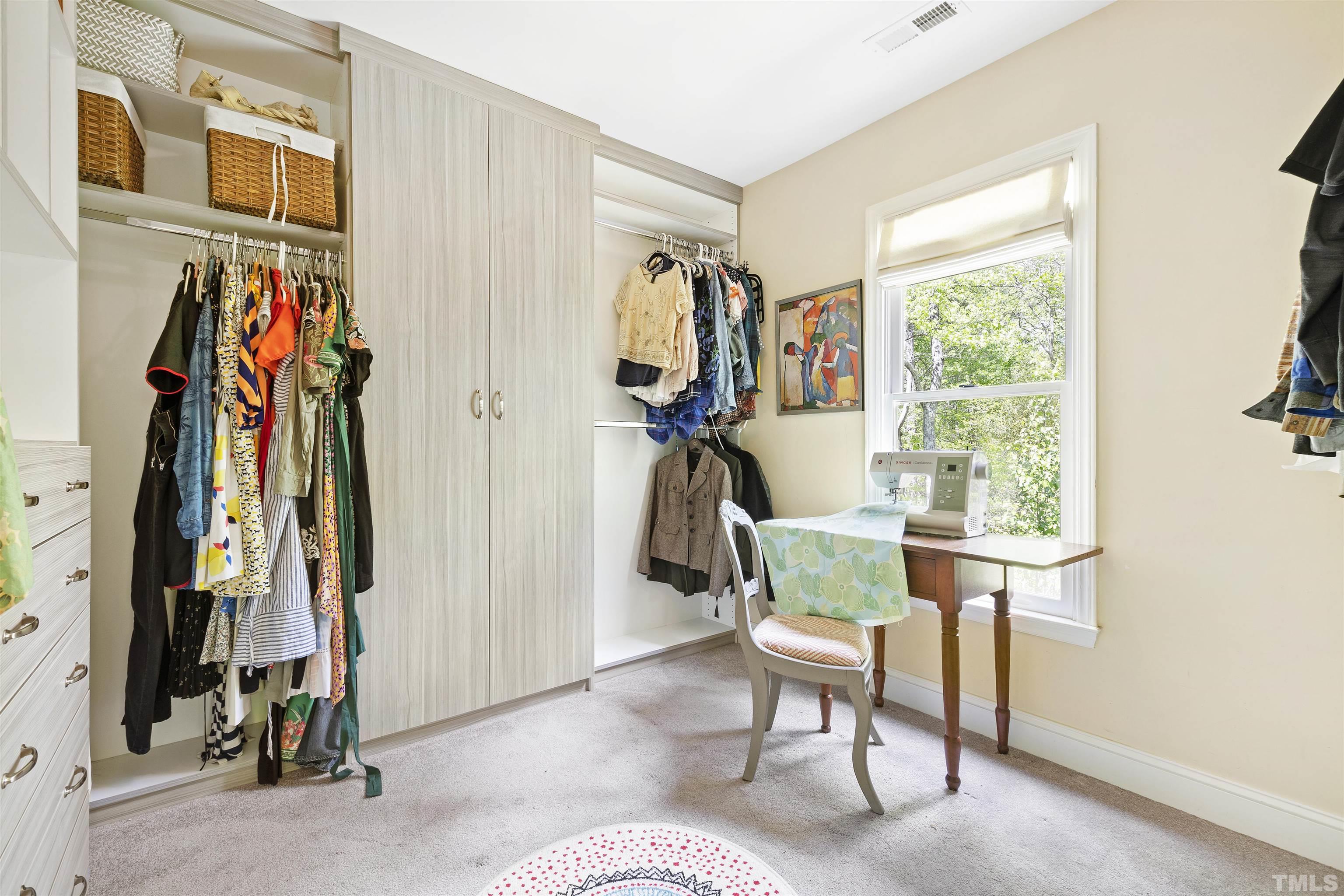 7039 Calais Drive Durham, NC 27712 - Photo 23 of 33 a view of a livingroom with furniture wooden floor and windows