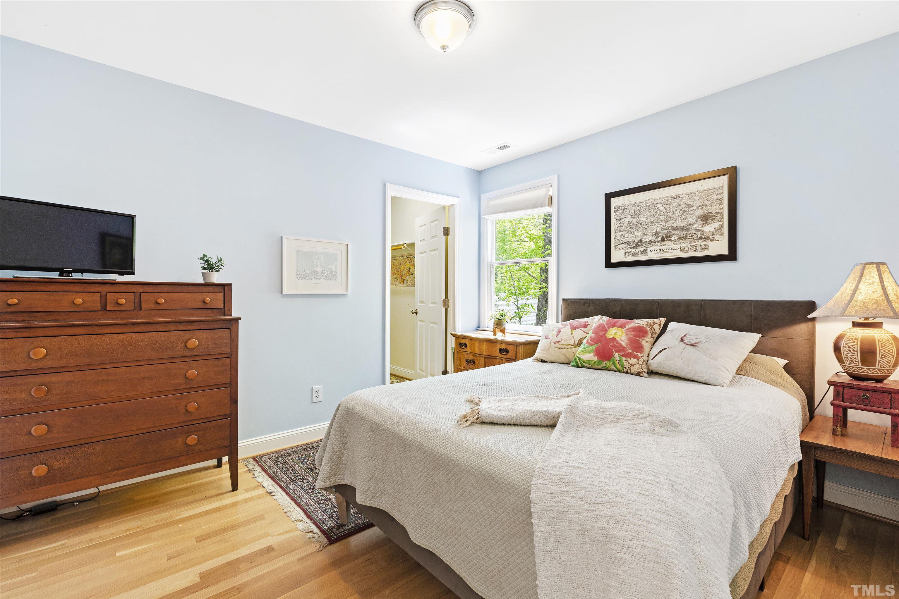 7039 Calais Drive Durham, NC 27712 - Photo 24 of 33 a bedroom with a bed and furniture