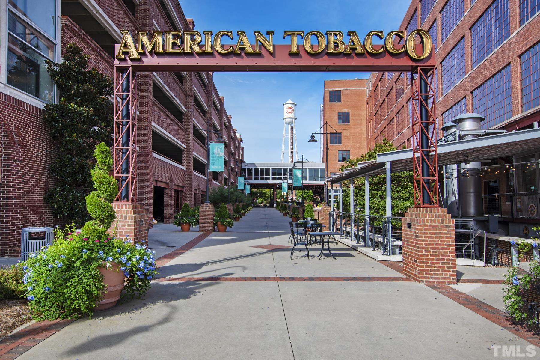 7039 Calais Drive Durham, NC 27712 - Photo 33 of 33 a building with potted plants in front of it