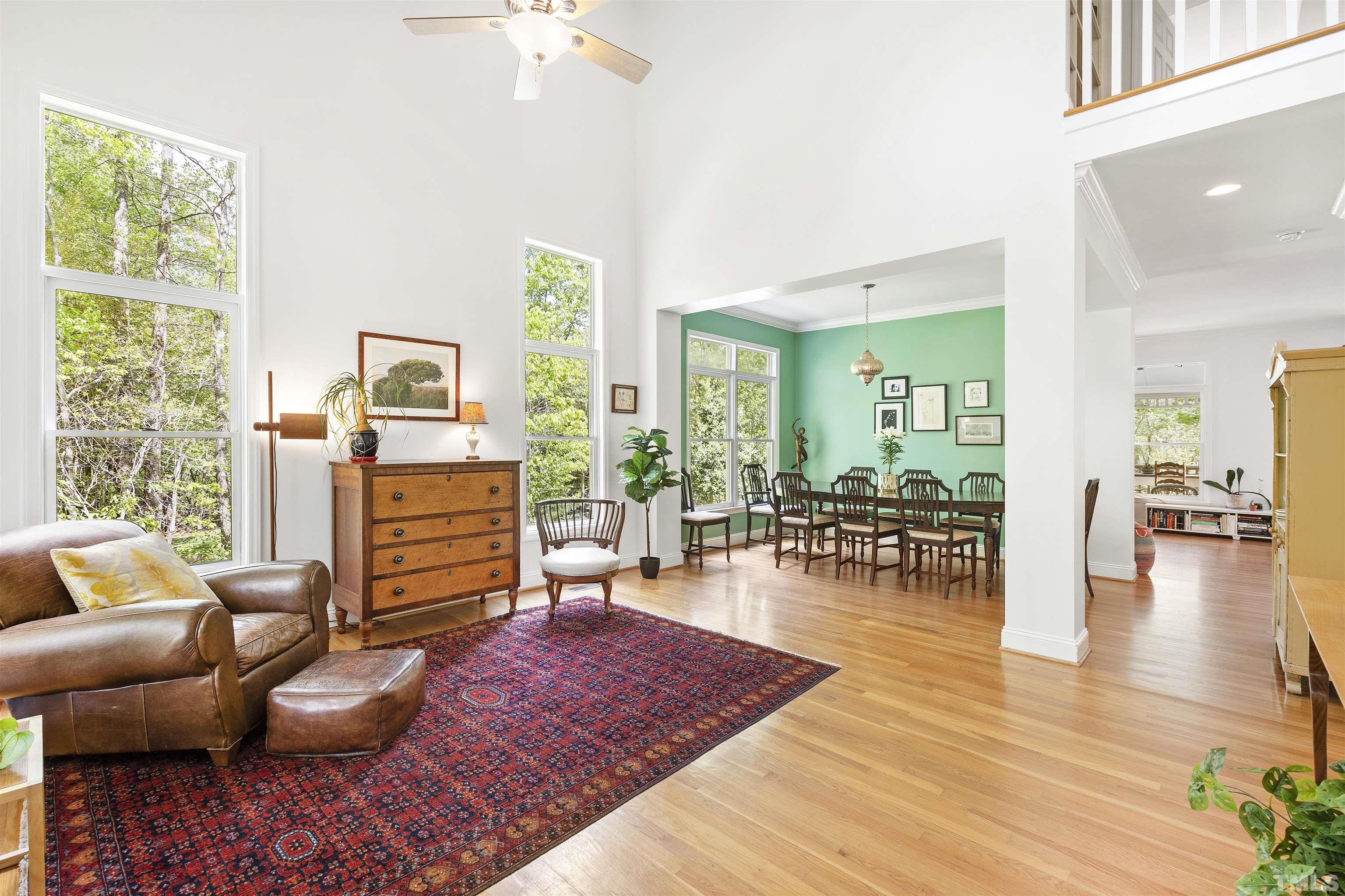 7039 Calais Drive Durham, NC 27712 - Photo 9 of 33 a living room with furniture and wooden floor