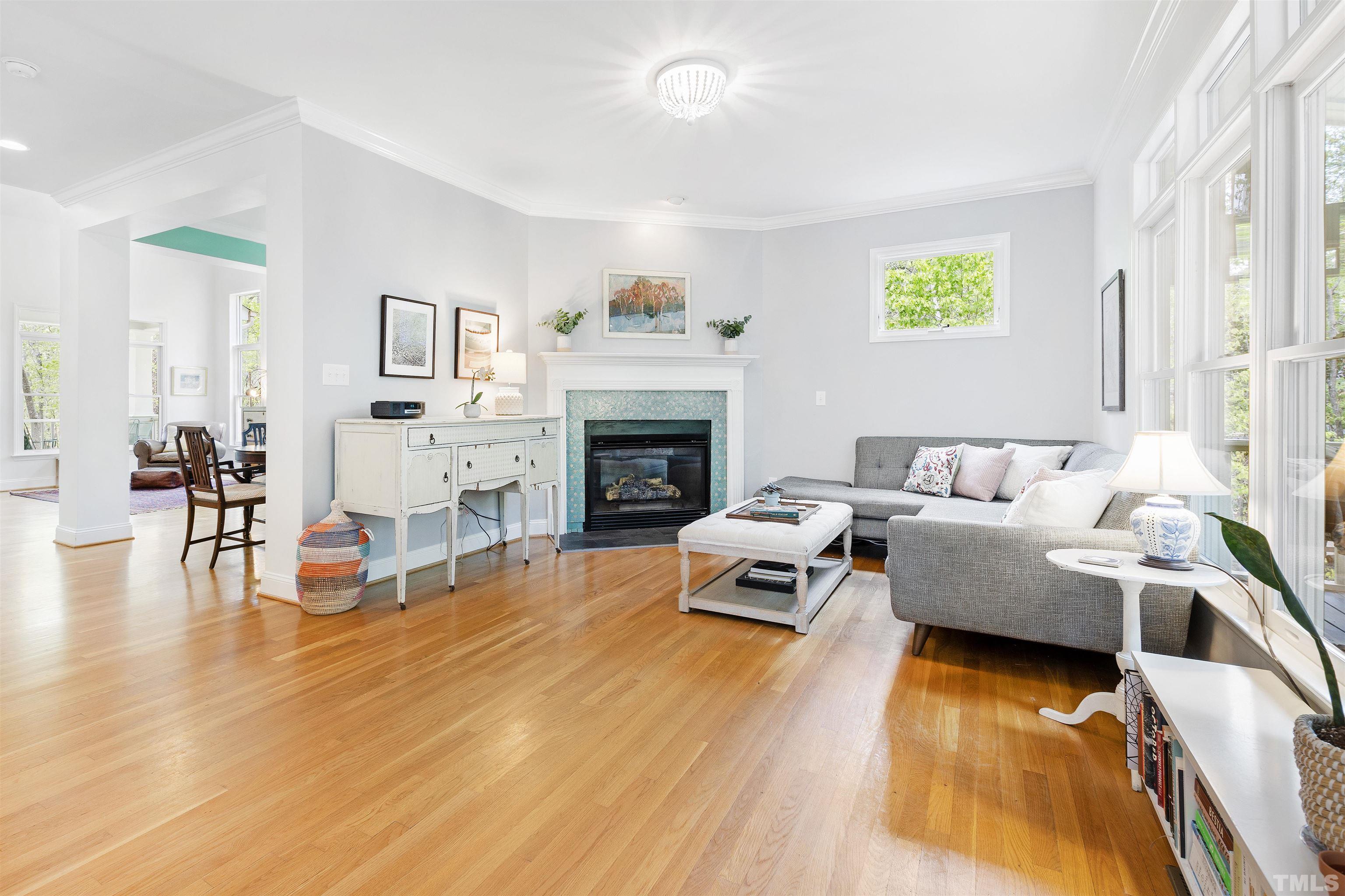7039 Calais Drive Durham, NC 27712 - Photo 10 of 33 a living room with furniture and a fireplace