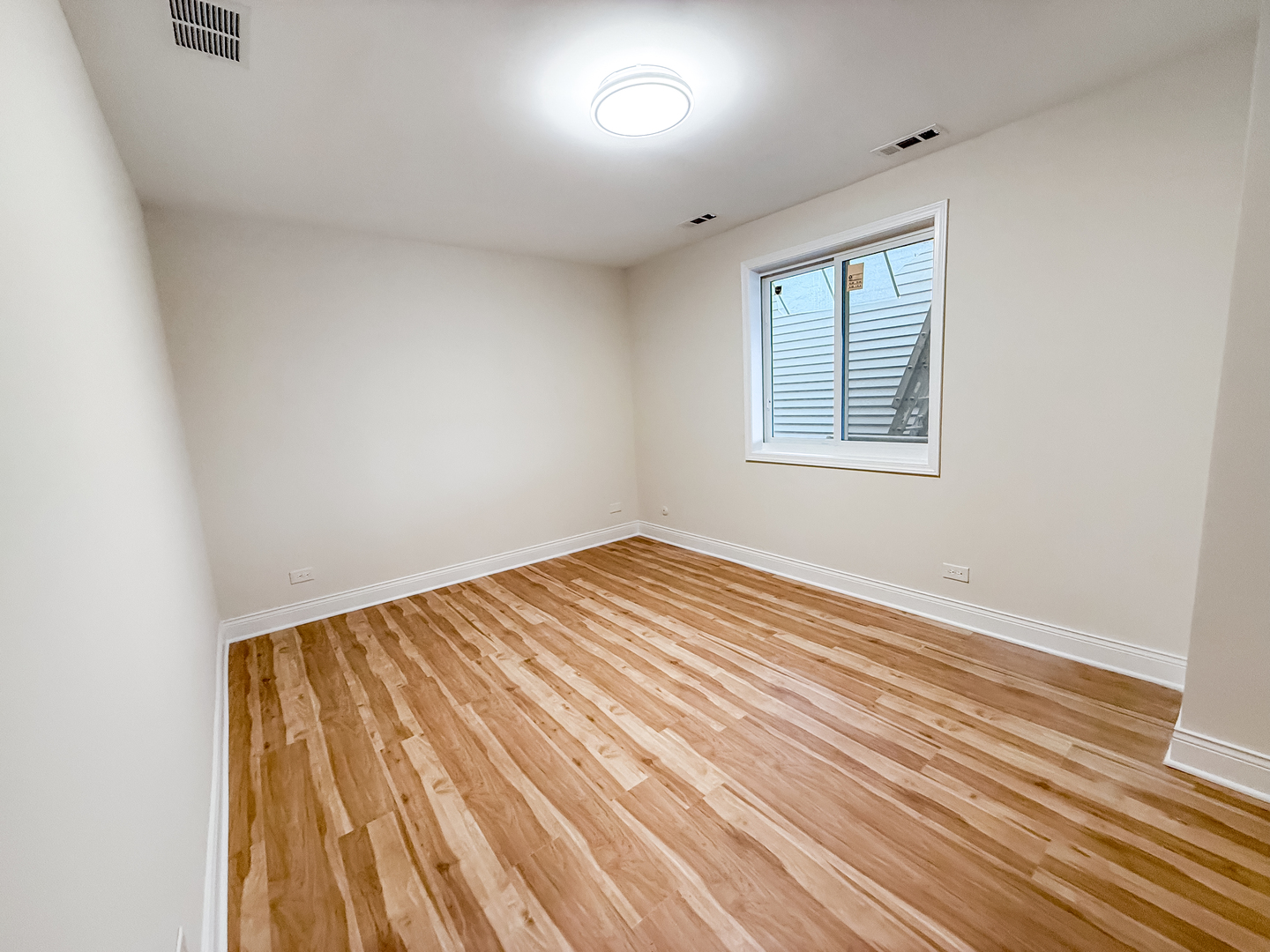 6415 West Irving Park Road, Unit 2S Chicago, IL 60634 - Photo 4 of 11 an empty room with window