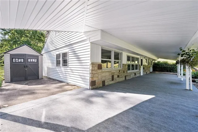 a view of a house with a yard and garage