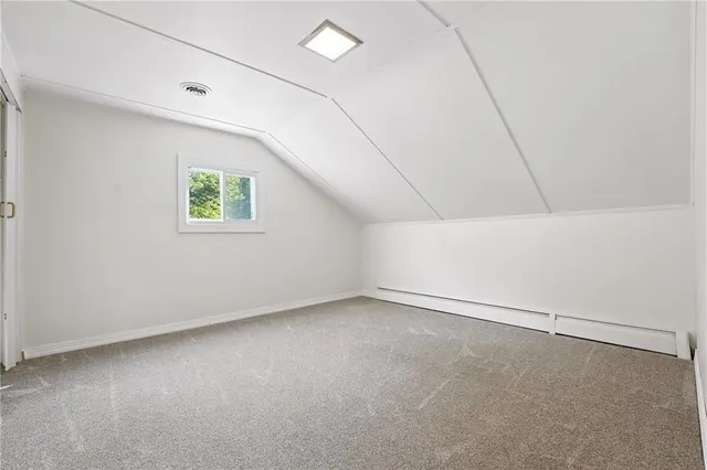 an aerial view of a house with swimming pool and a yard