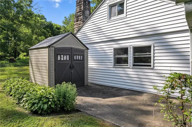 a view of a house with a yard and plants