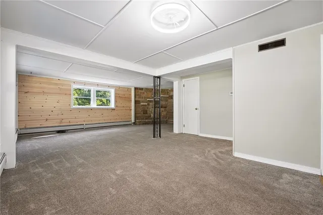 an empty room with a empty space and windows