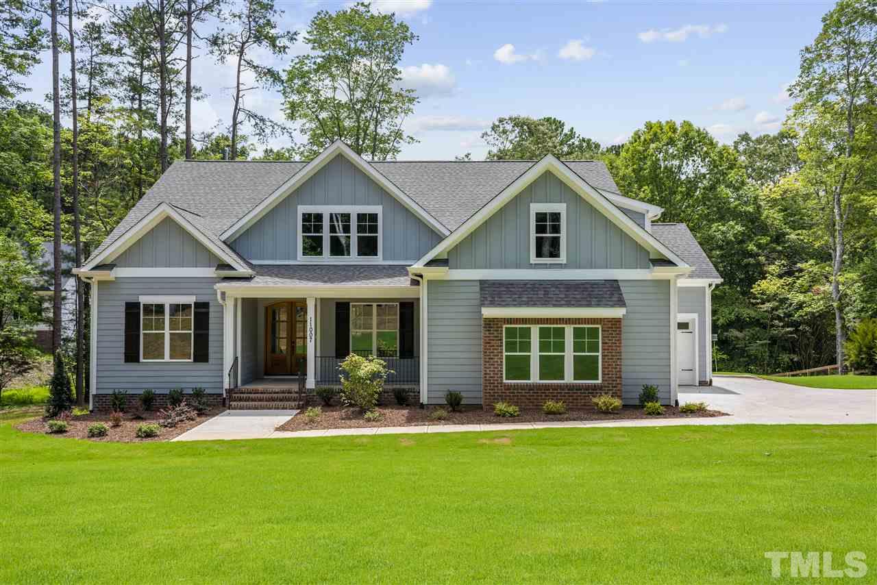 11007 Crest Mist Circle Raleigh, NC 27613 - Photo 1 of 30 Welcome home to this new, custom constructed home on over an acre home site with no HOA/Covenants. Relax on the front porch and enjoy your peaceful surroundings.
