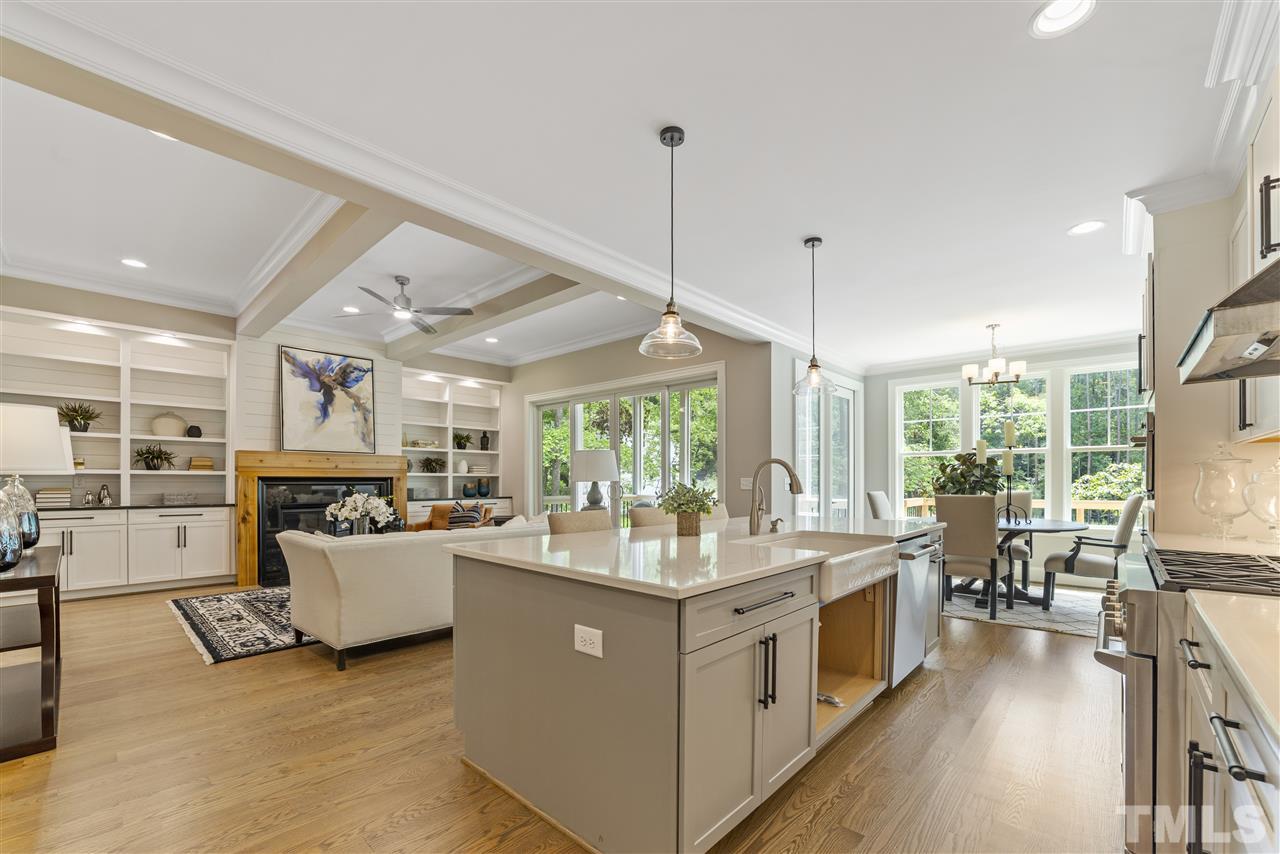11007 Crest Mist Circle Raleigh, NC 27613 - Photo 12 of 30 The huge island is a great gathering place as well as works space. There is a large porcelain farm sink (builder is waiting on cabinet doors to arrive for beneath sink and will be installed asap). There are pendants lights above the island as well.