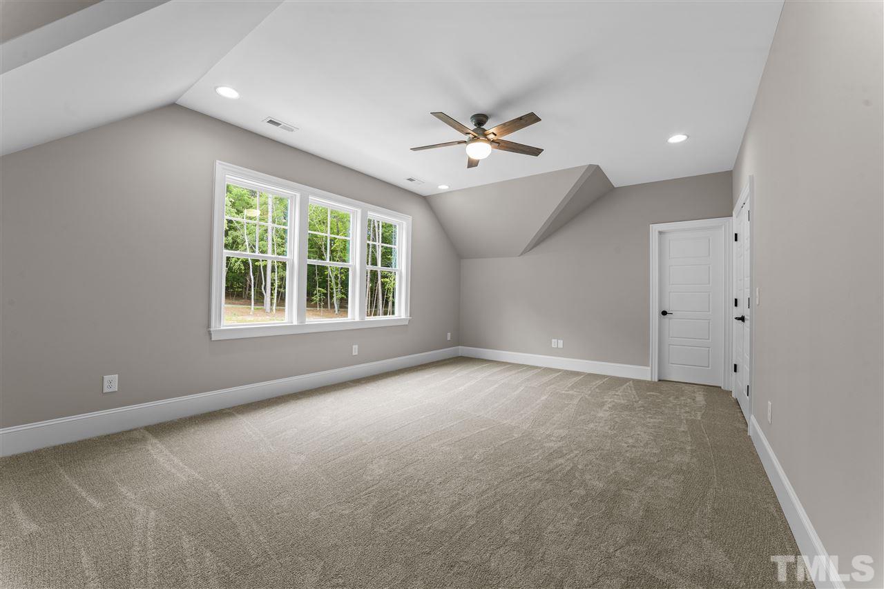 11007 Crest Mist Circle Raleigh, NC 27613 - Photo 18 of 30 The bedrooms on the second floor are very large. This one has a walk in closet and private bathroom.