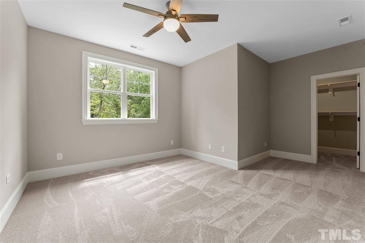 11007 Crest Mist Circle Raleigh, NC 27613 - Photo 19 of 30 This bedroom has a walk in closet.
