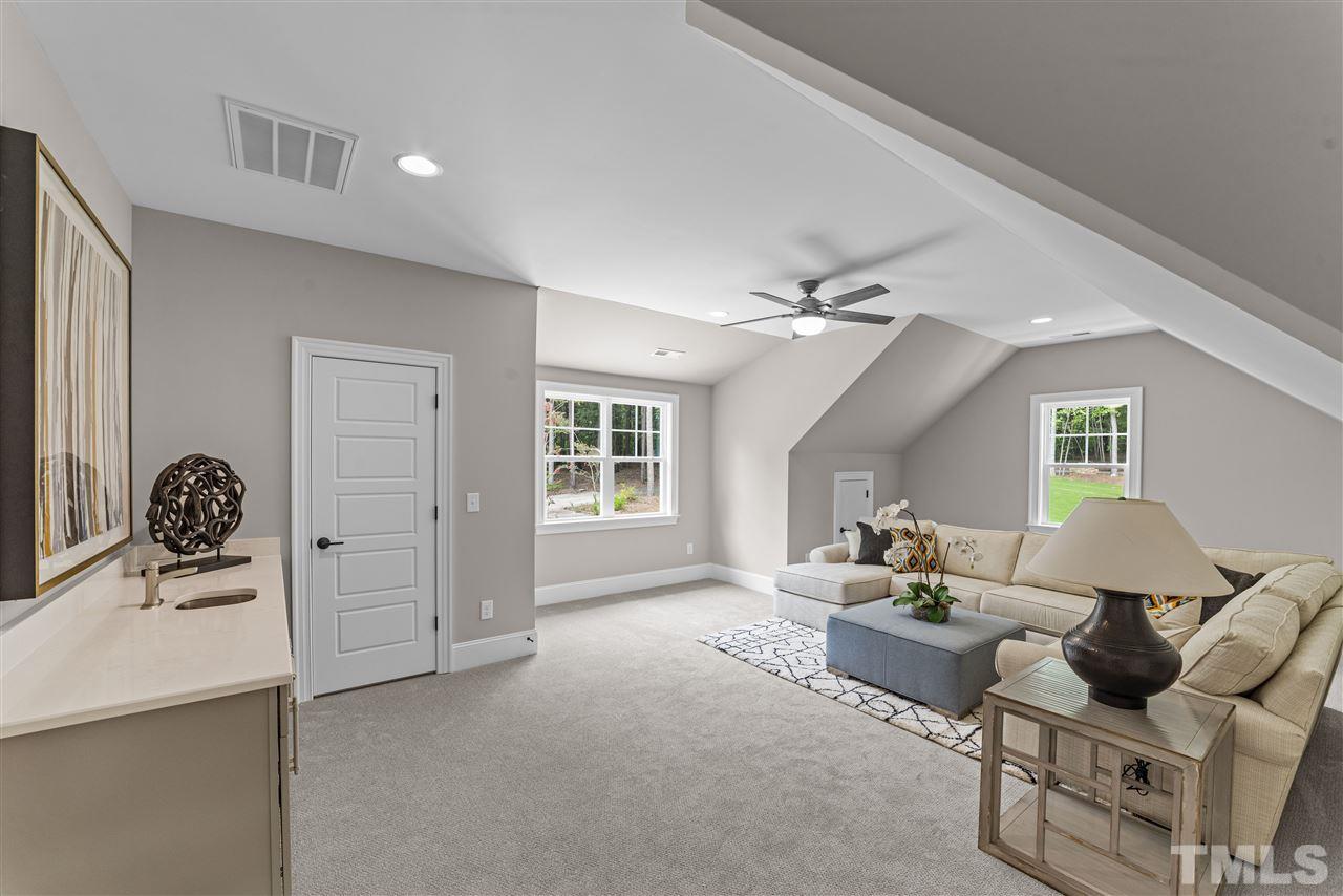 11007 Crest Mist Circle Raleigh, NC 27613 - Photo 20 of 30 Upstairs there is a bonus room with walk in closet and wet bar (with space for a beverage fridge).