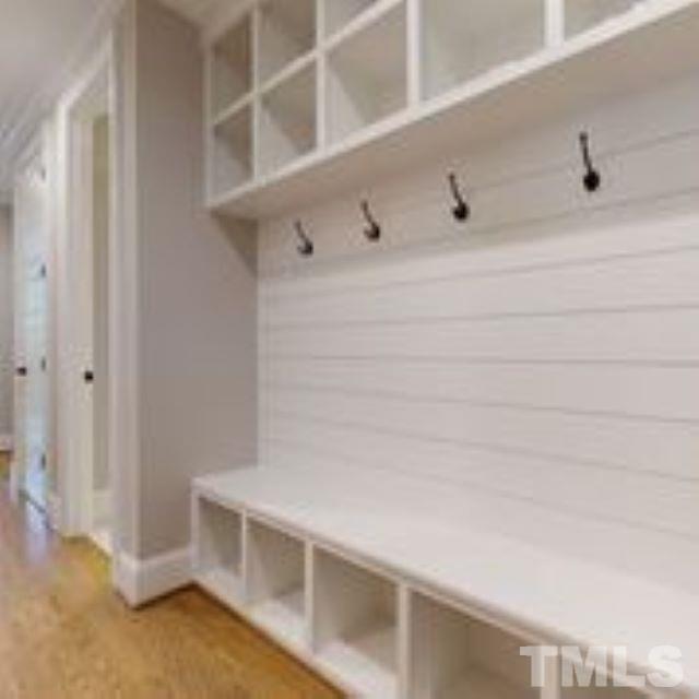 11007 Crest Mist Circle Raleigh, NC 27613 - Photo 22 of 30 The drop zone in the home is amazing with cubbies to the ceiling, hooks and bench!