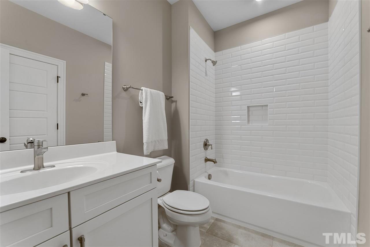 11007 Crest Mist Circle Raleigh, NC 27613 - Photo 24 of 30 The gorgeous tile work is in all of the bathrooms.
