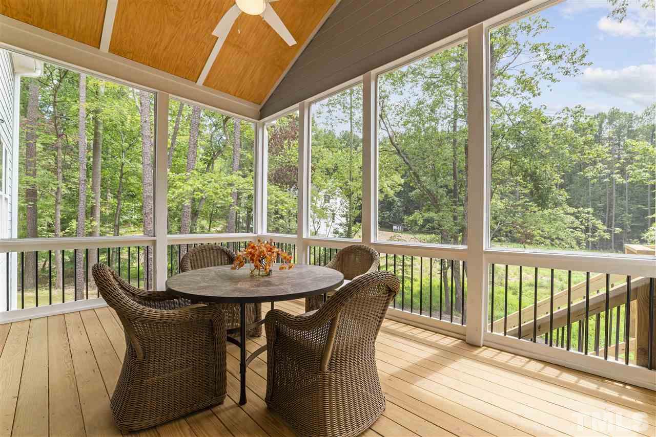 11007 Crest Mist Circle Raleigh, NC 27613 - Photo 25 of 30 The screened porch has a vaulted ceiling with bead board and a fan.