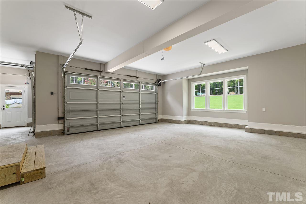 11007 Crest Mist Circle Raleigh, NC 27613 - Photo 26 of 30 There is an oversized 2 car garage plus a large one car with plenty of outlets. Home is roughed in for central vac.