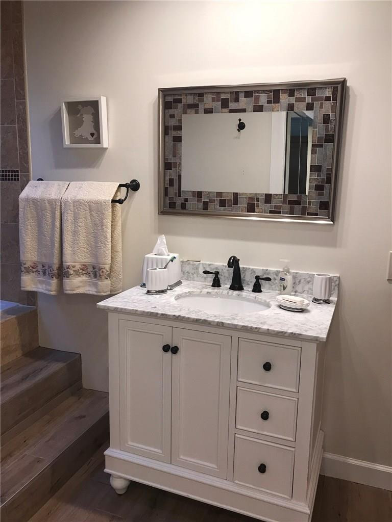 6548 Patio Lane, Unit 4 Boca Raton, FL 33433 - Photo 16 of 28 Master bathrom with new vanity/flooring.