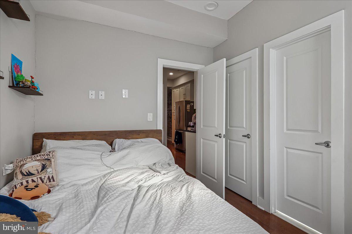 30 Hanover Place Northwest, Unit 1 Washington, DC 20001 - Photo 11 of 20 a bedroom with a bed and a window
