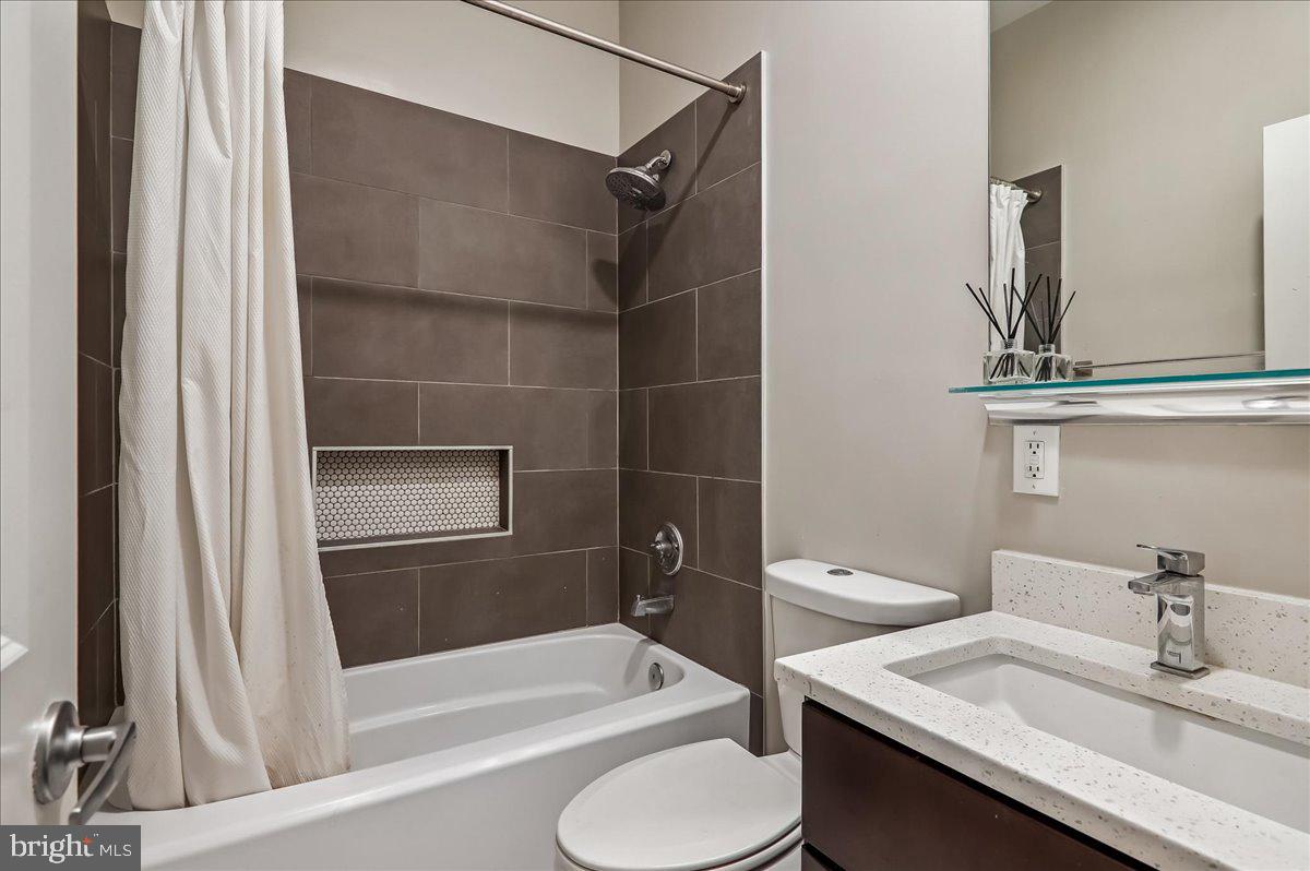 30 Hanover Place Northwest, Unit 1 Washington, DC 20001 - Photo 12 of 20 a bathroom with a sink a toilet and shower