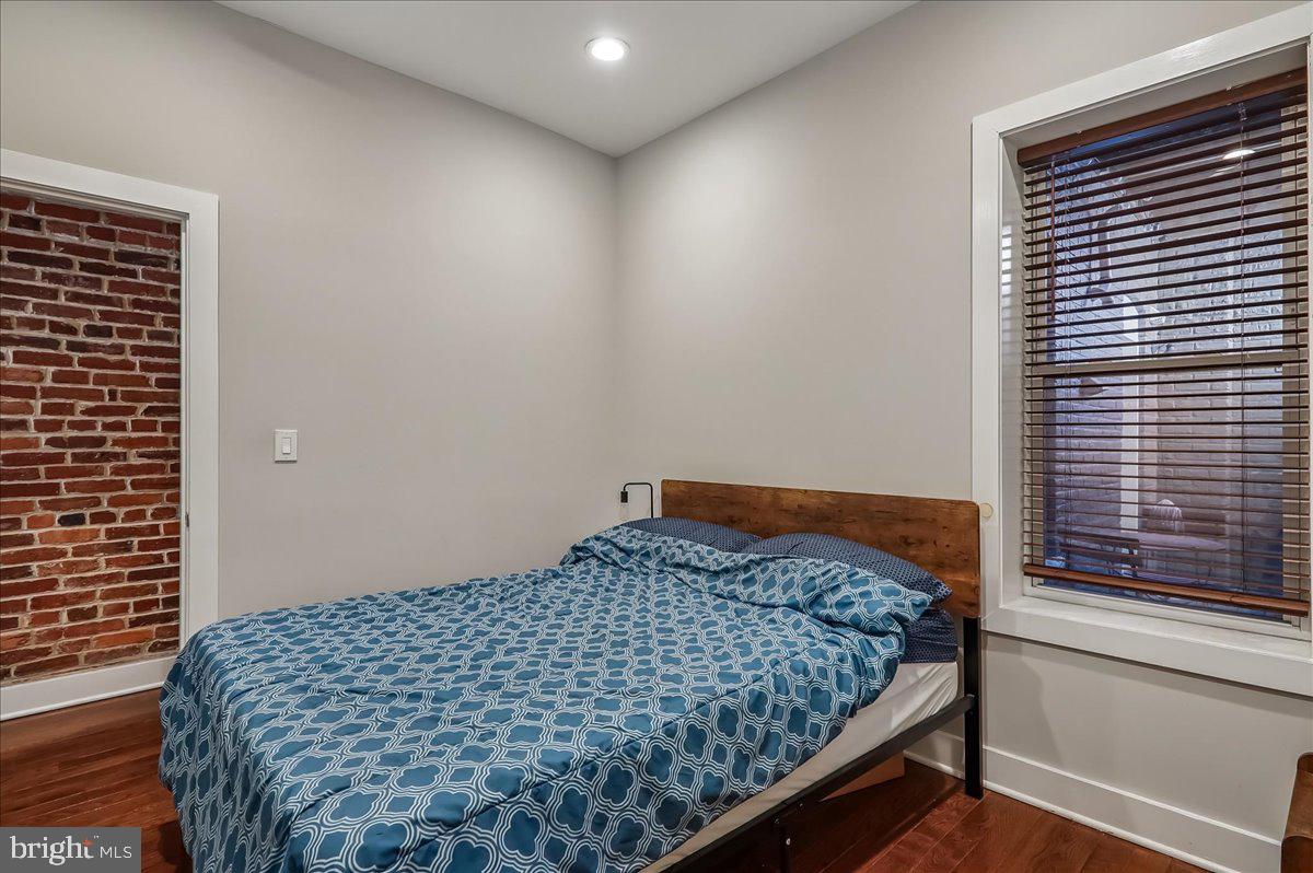 30 Hanover Place Northwest, Unit 1 Washington, DC 20001 - Photo 14 of 20 a bedroom with a bed and window