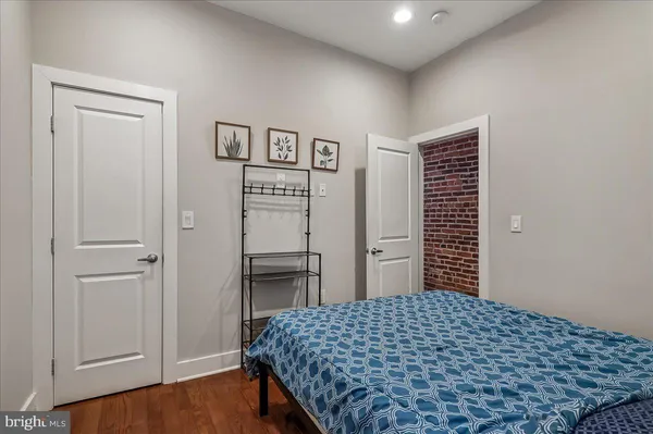 a bedroom with a bed and a table