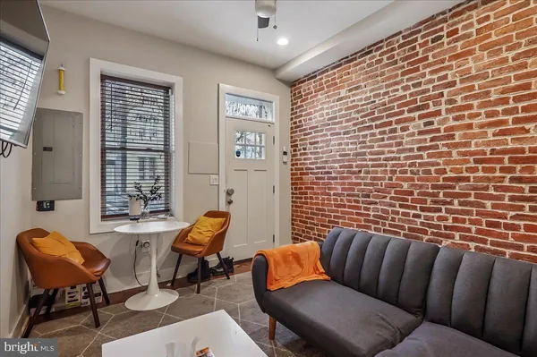 a reading room with furniture and a window