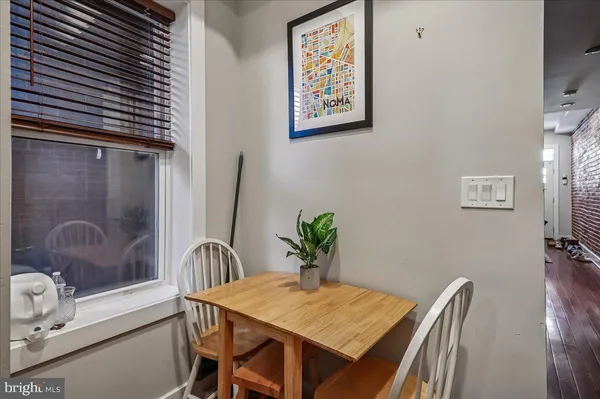 a dining room with furniture and window