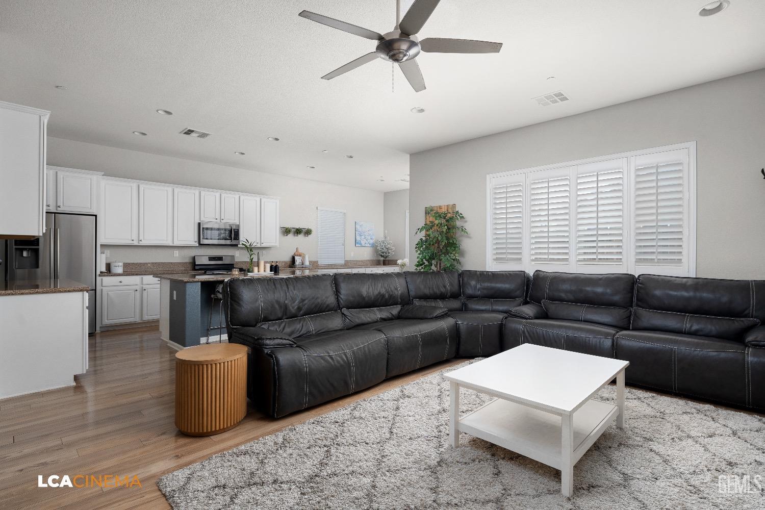 Undisclosed Address Bakersfield, CA 93314 - Photo 11 of 29 a living room with furniture and kitchen view