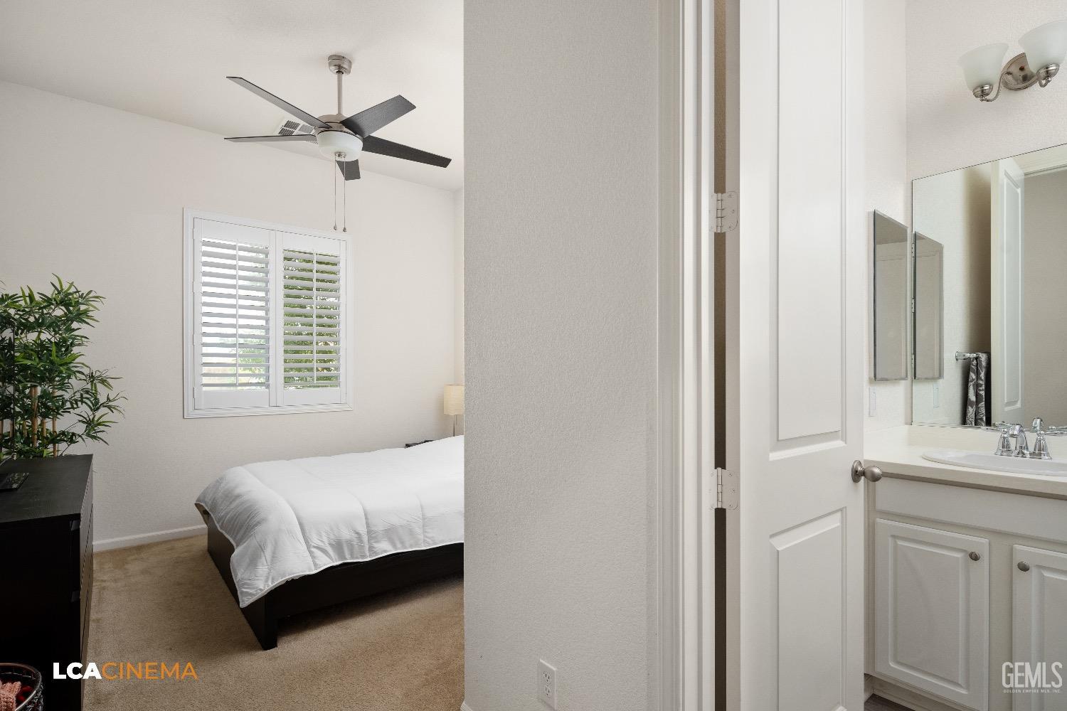 Undisclosed Address Bakersfield, CA 93314 - Photo 18 of 29 a bedroom with a bed and a chandelier