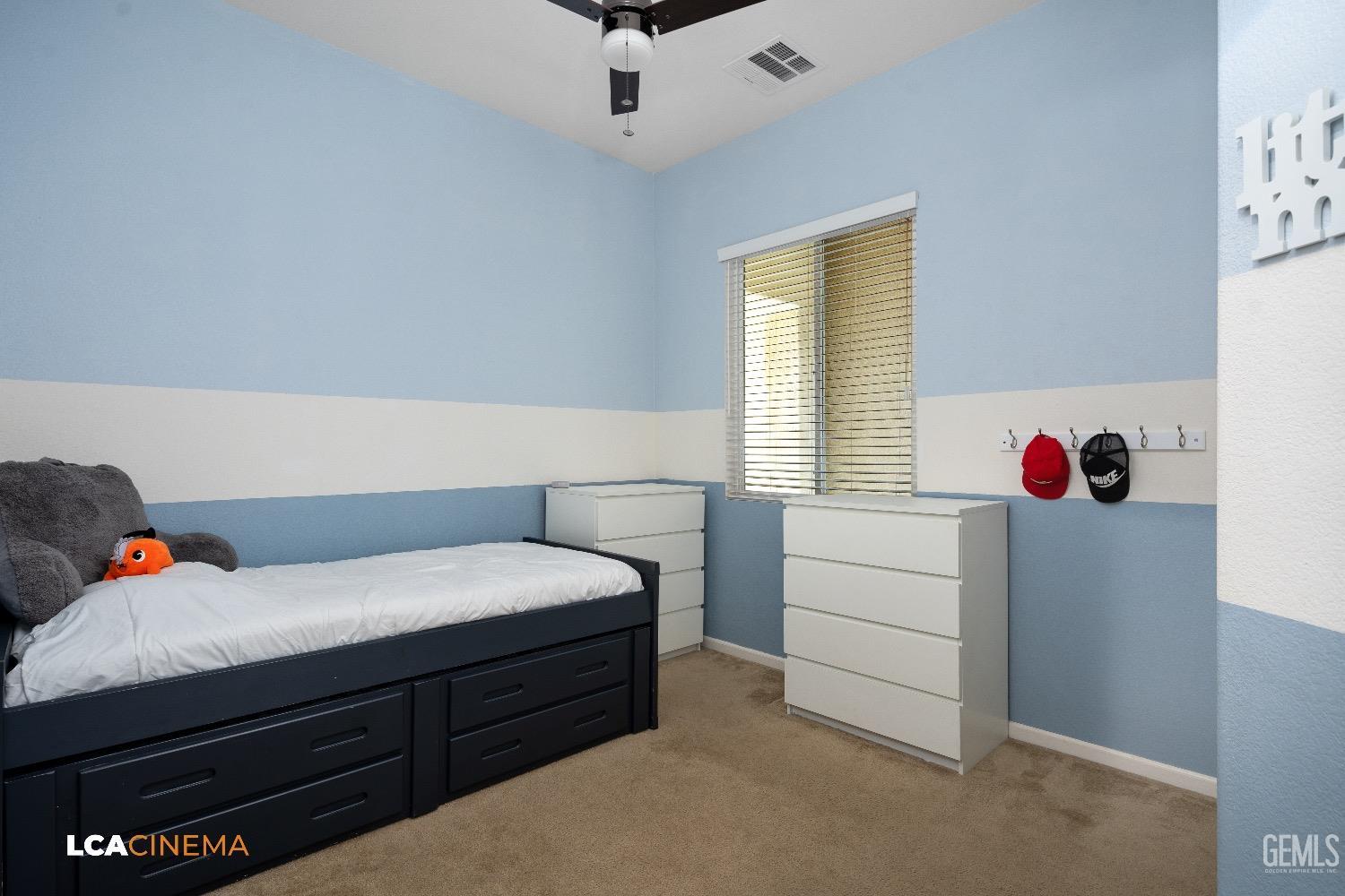 Undisclosed Address Bakersfield, CA 93314 - Photo 20 of 29 a bedroom with a bed and a window