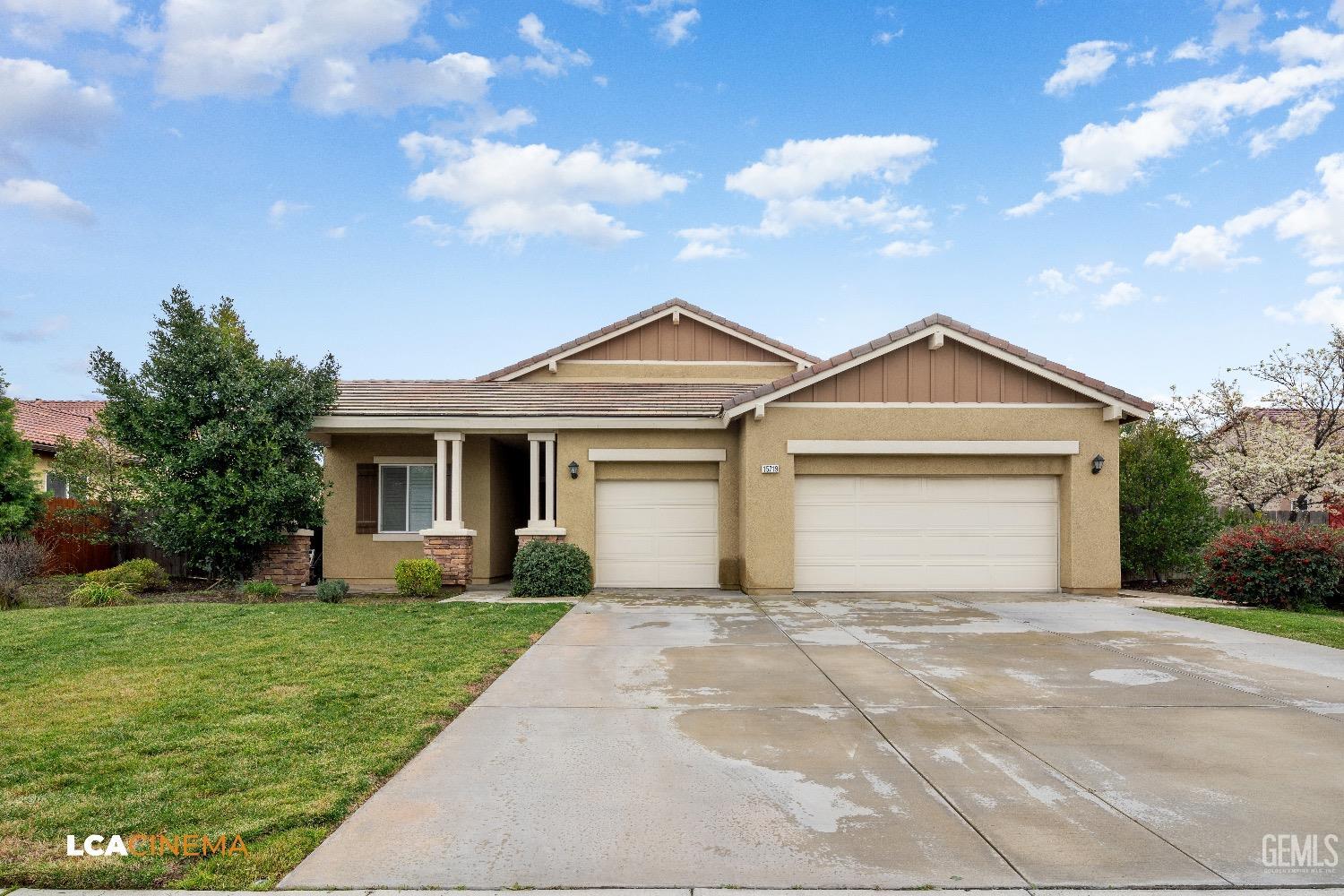 Undisclosed Address Bakersfield, CA 93314 - Photo 2 of 29 a front view of a house with a yard and garage