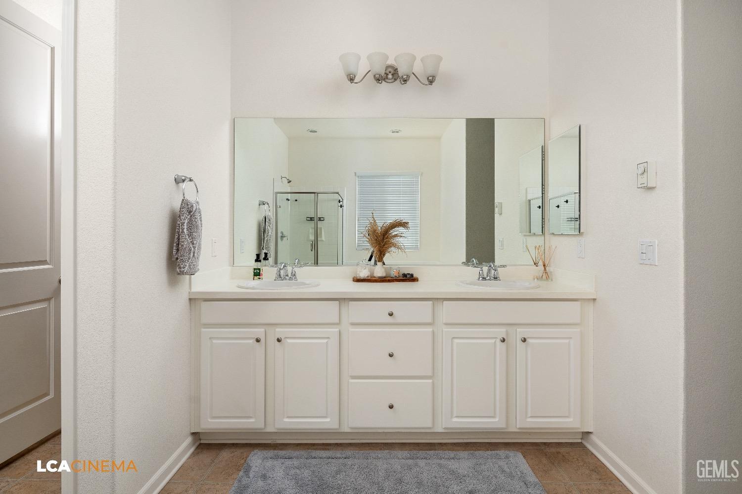 Undisclosed Address Bakersfield, CA 93314 - Photo 25 of 29 a bathroom with a sink and a mirror