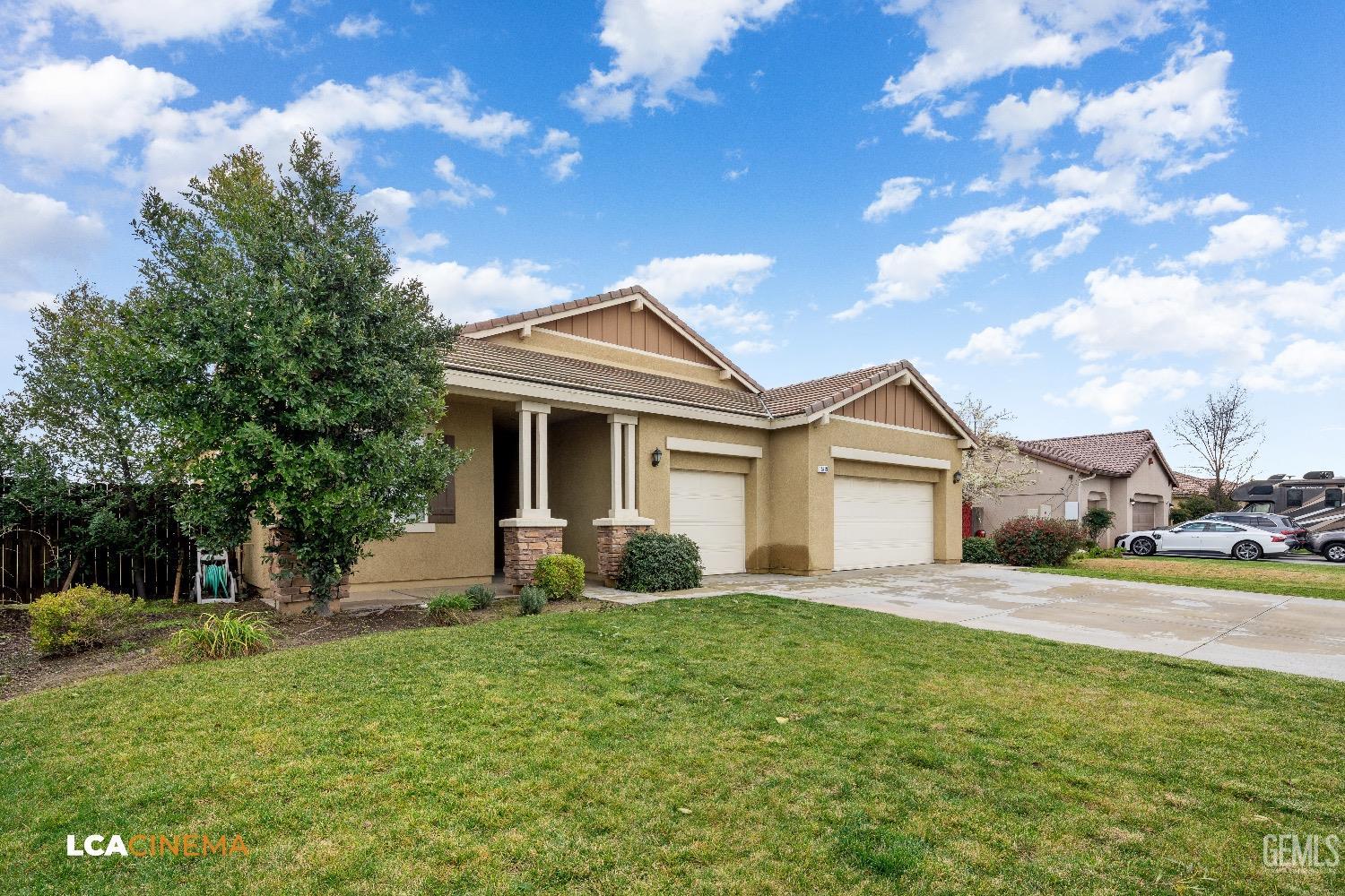 Undisclosed Address Bakersfield, CA 93314 - Photo 3 of 29 a front view of a house with a garden and yard