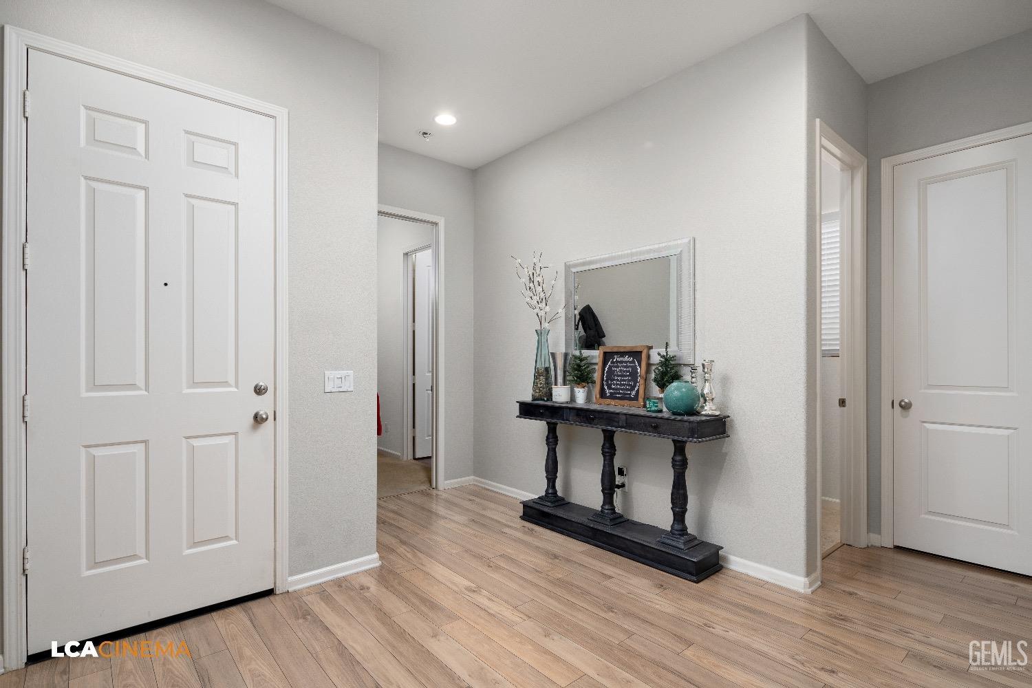 Undisclosed Address Bakersfield, CA 93314 - Photo 6 of 29 a view of a hallway with wooden floor and closet