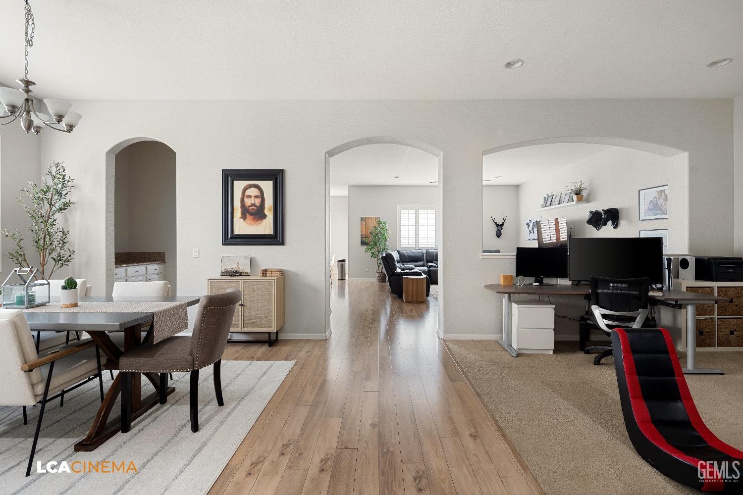 Undisclosed Address Bakersfield, CA 93314 - Photo 8 of 29 a dining room with wooden floor a glass table and chairs