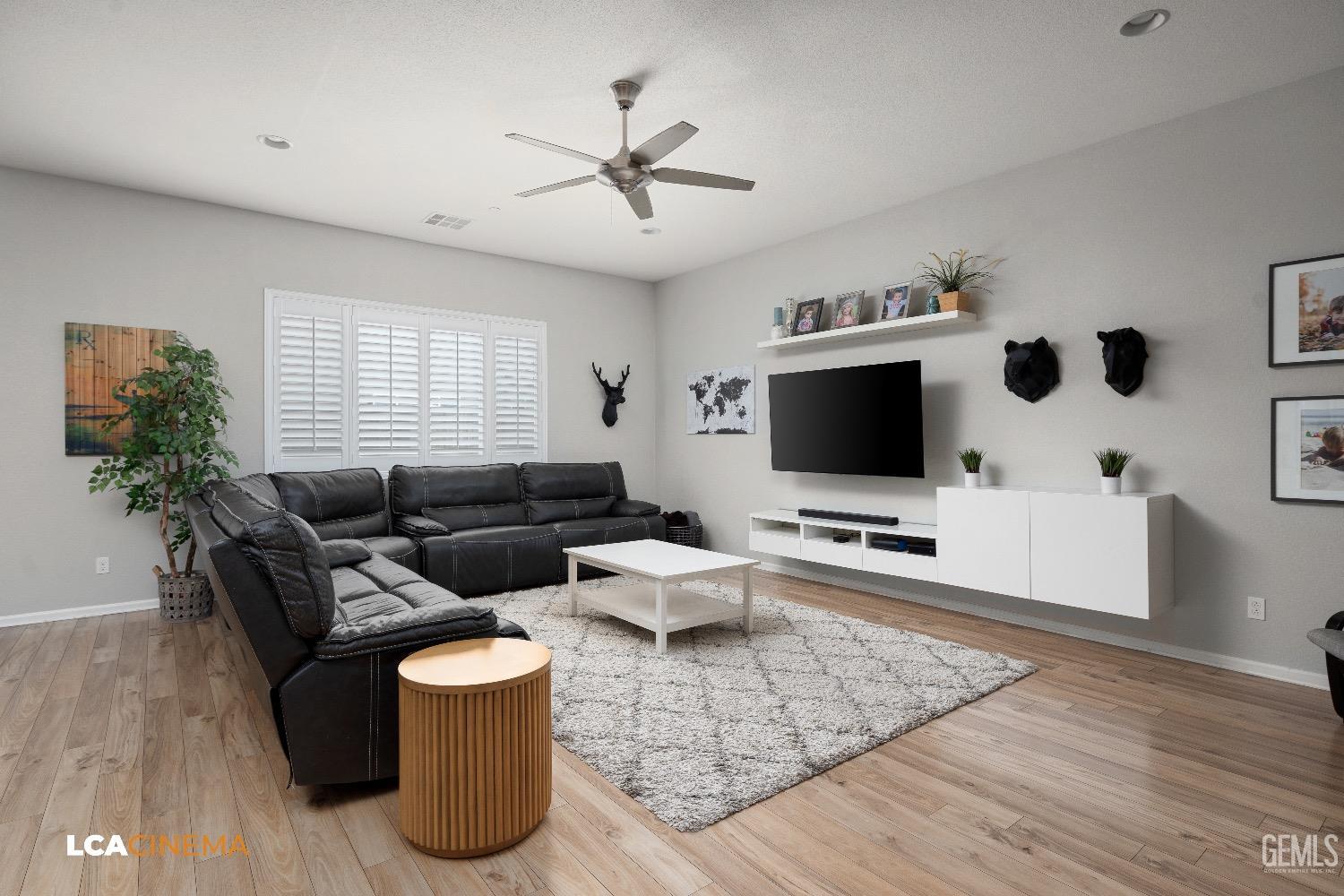 Undisclosed Address Bakersfield, CA 93314 - Photo 10 of 29 a living room with furniture and a flat screen tv