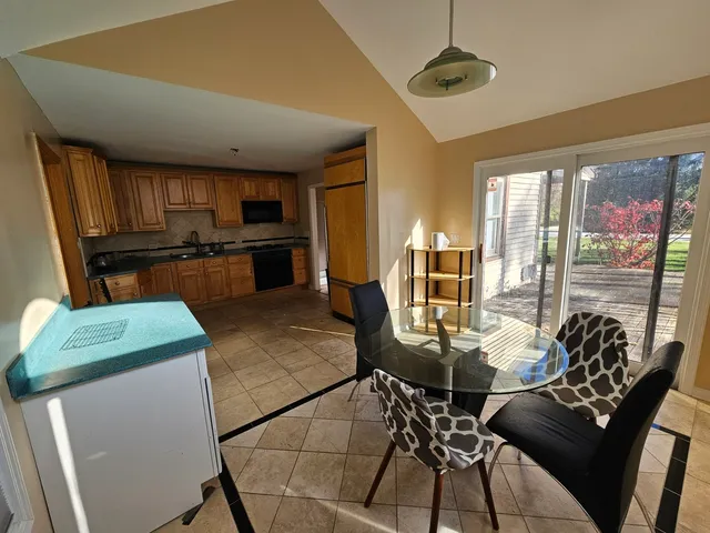 a view of a dining room with furniture window and outside view