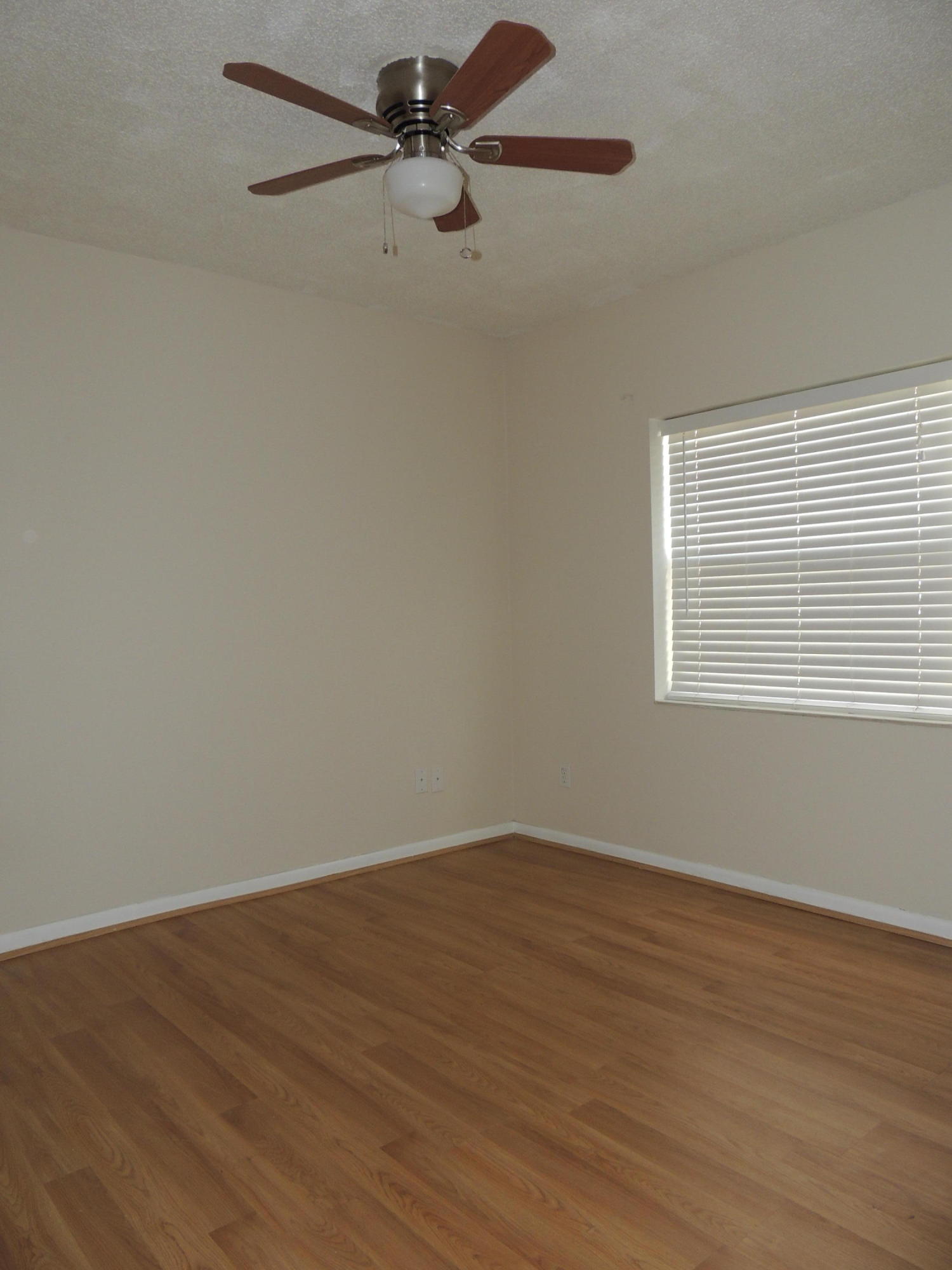 1829 Abbey Road West Palm Beach, FL 33415 - Photo 14 of 15 wooden floor in an empty room with a window