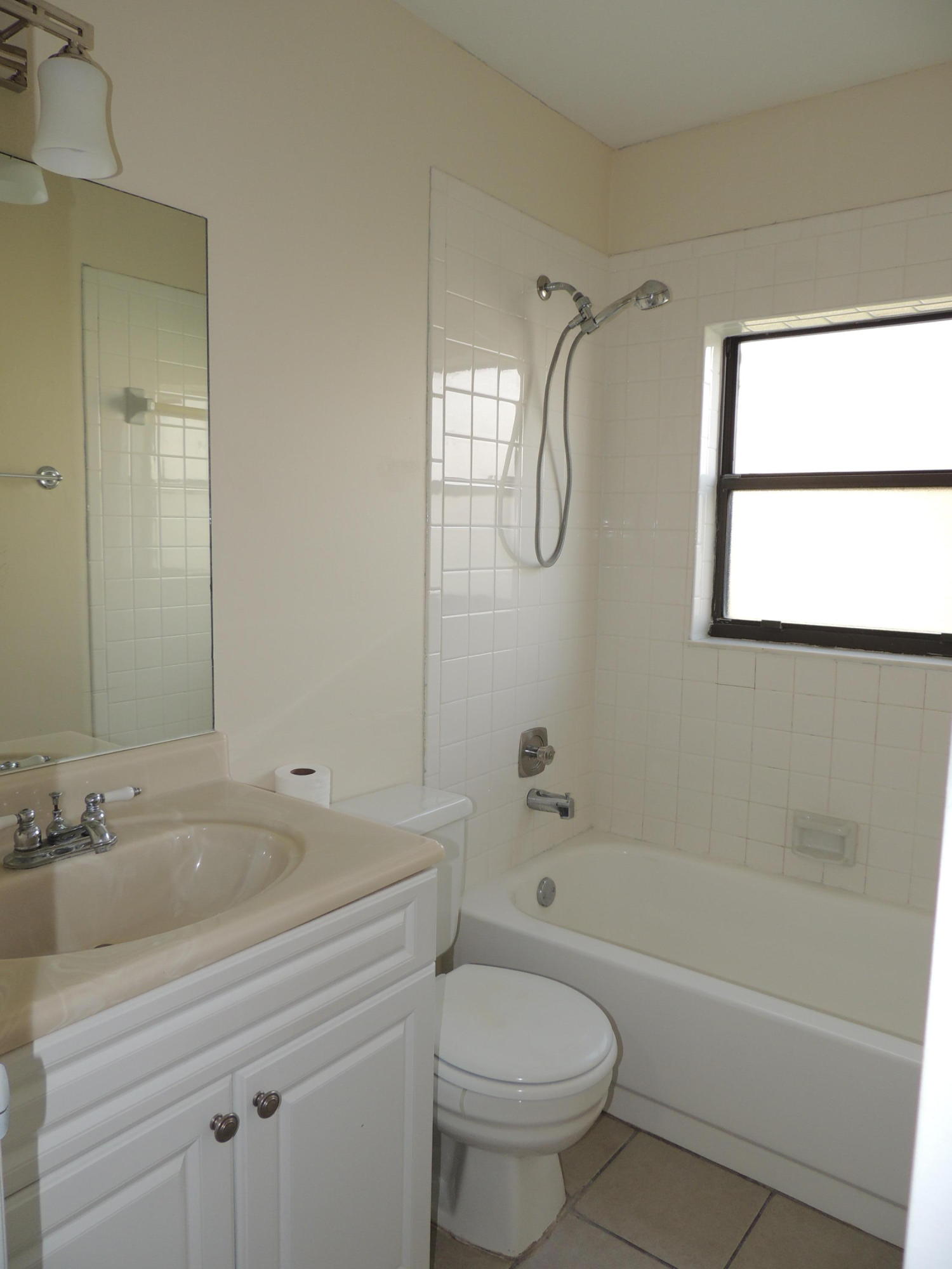 1829 Abbey Road West Palm Beach, FL 33415 - Photo 15 of 15 a bathroom with a sink a toilet and a bathtub