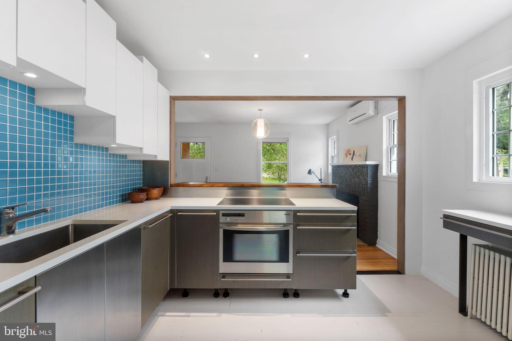 5807 Taylor Road Riverdale, MD 20737 - Photo 16 of 66 a kitchen with stainless steel appliances a stove and a sink